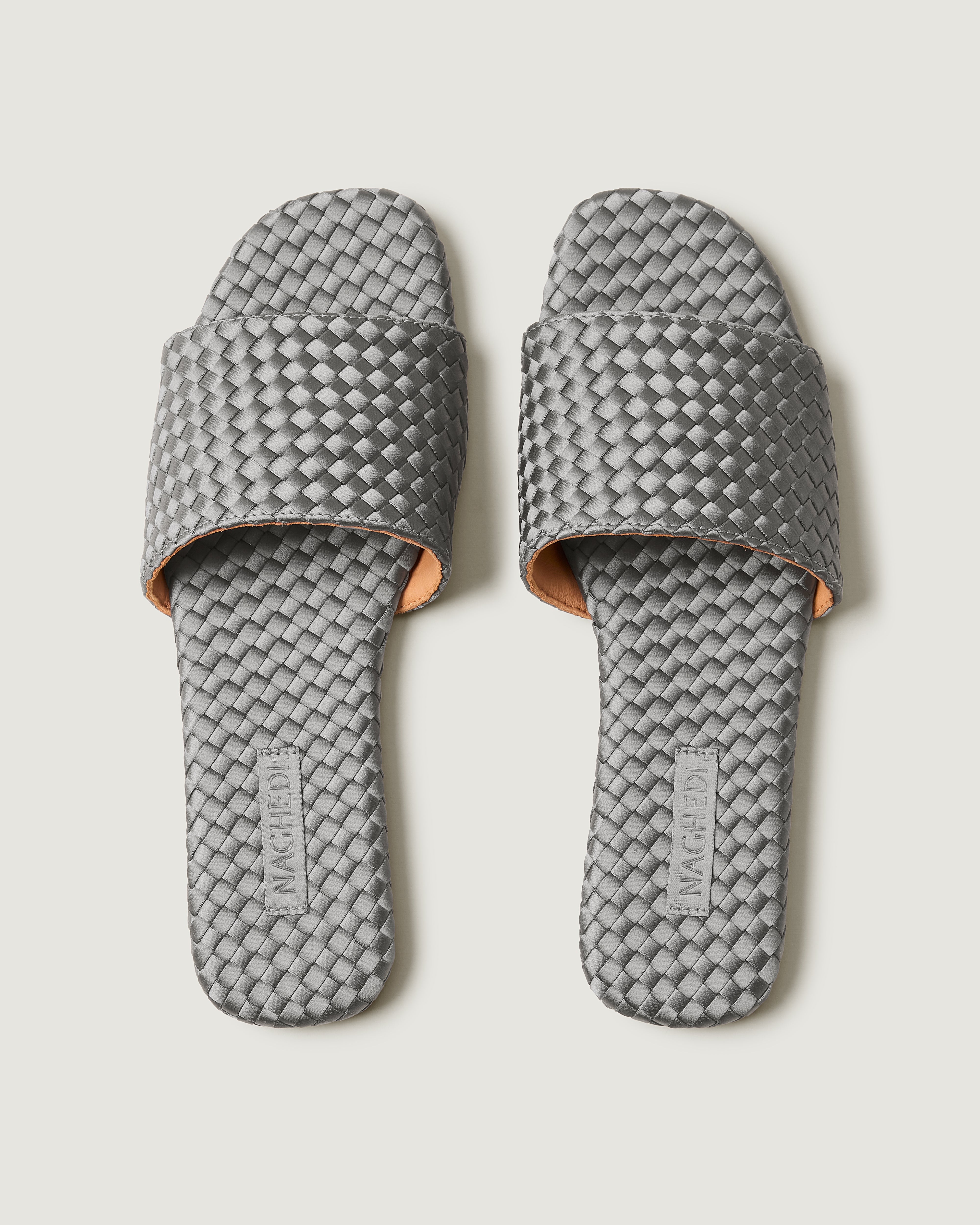 Top view of pair of The St. Barths Slide in Graphite showing the handwoven neoprene insole.
