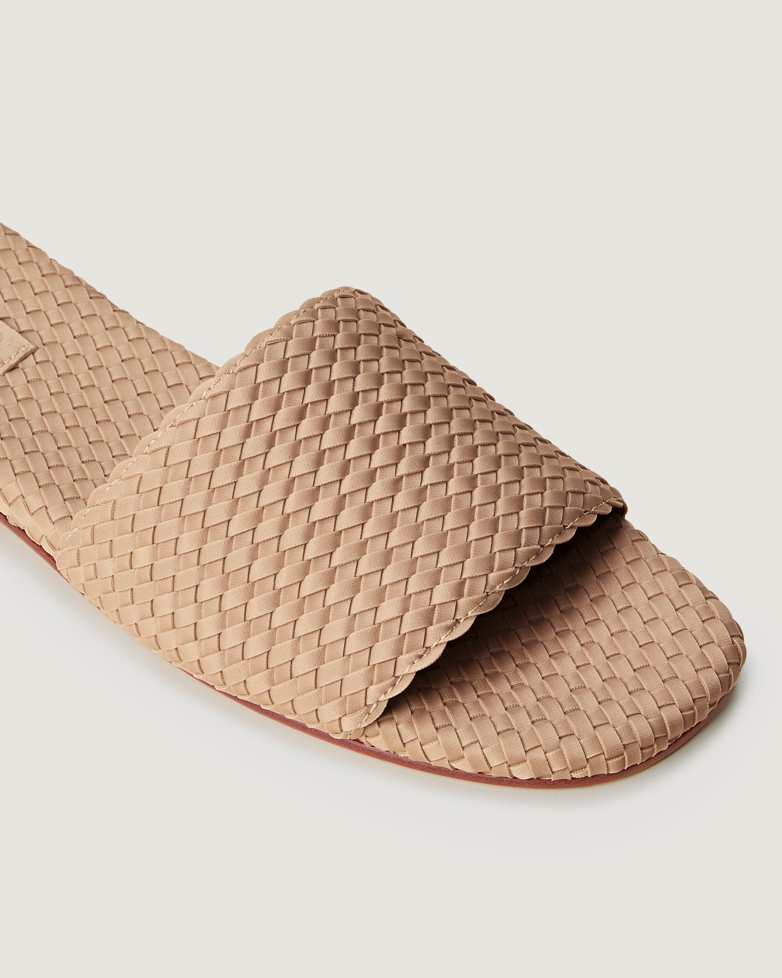 Close-up of The St. Barths Slide in Camel showing its open toe and square silhouette.