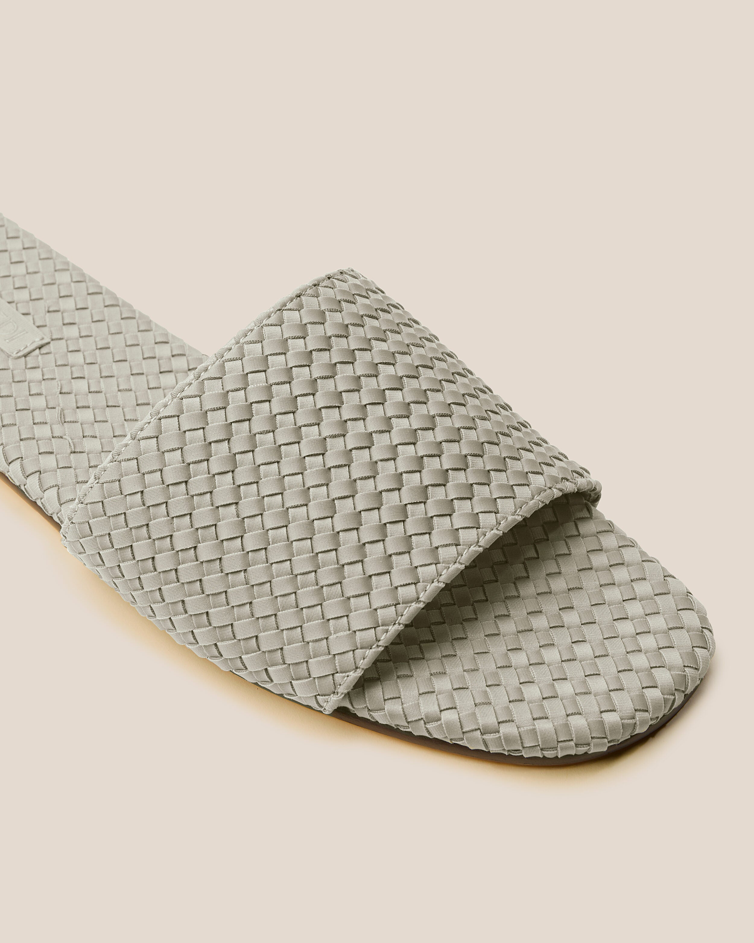 Close-up of The St. Barths Slide in Celadon showing its open toe and square silhouette.