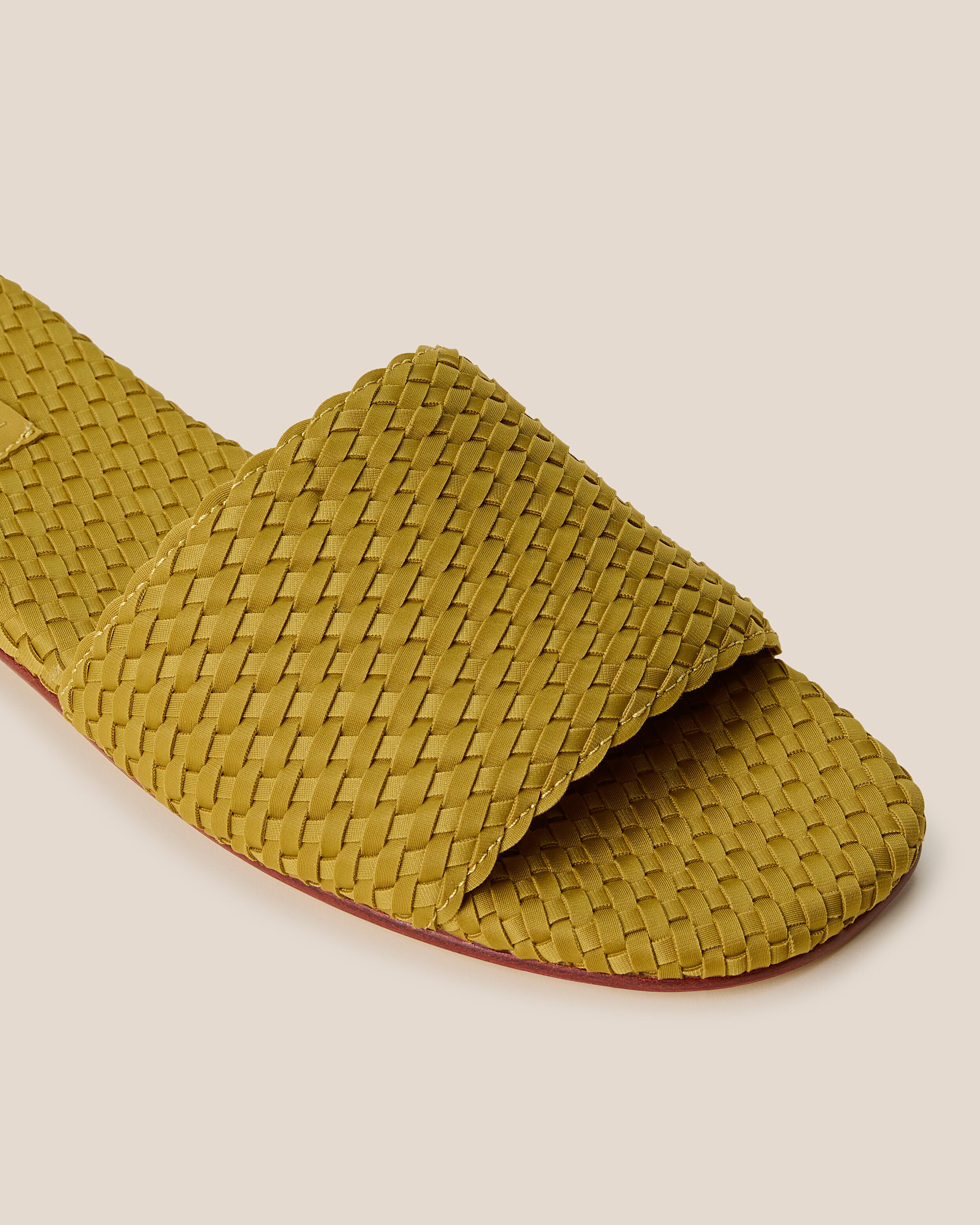 Close-up of The St. Barths Slide in Chartreuse showing its open toe and square silhouette.