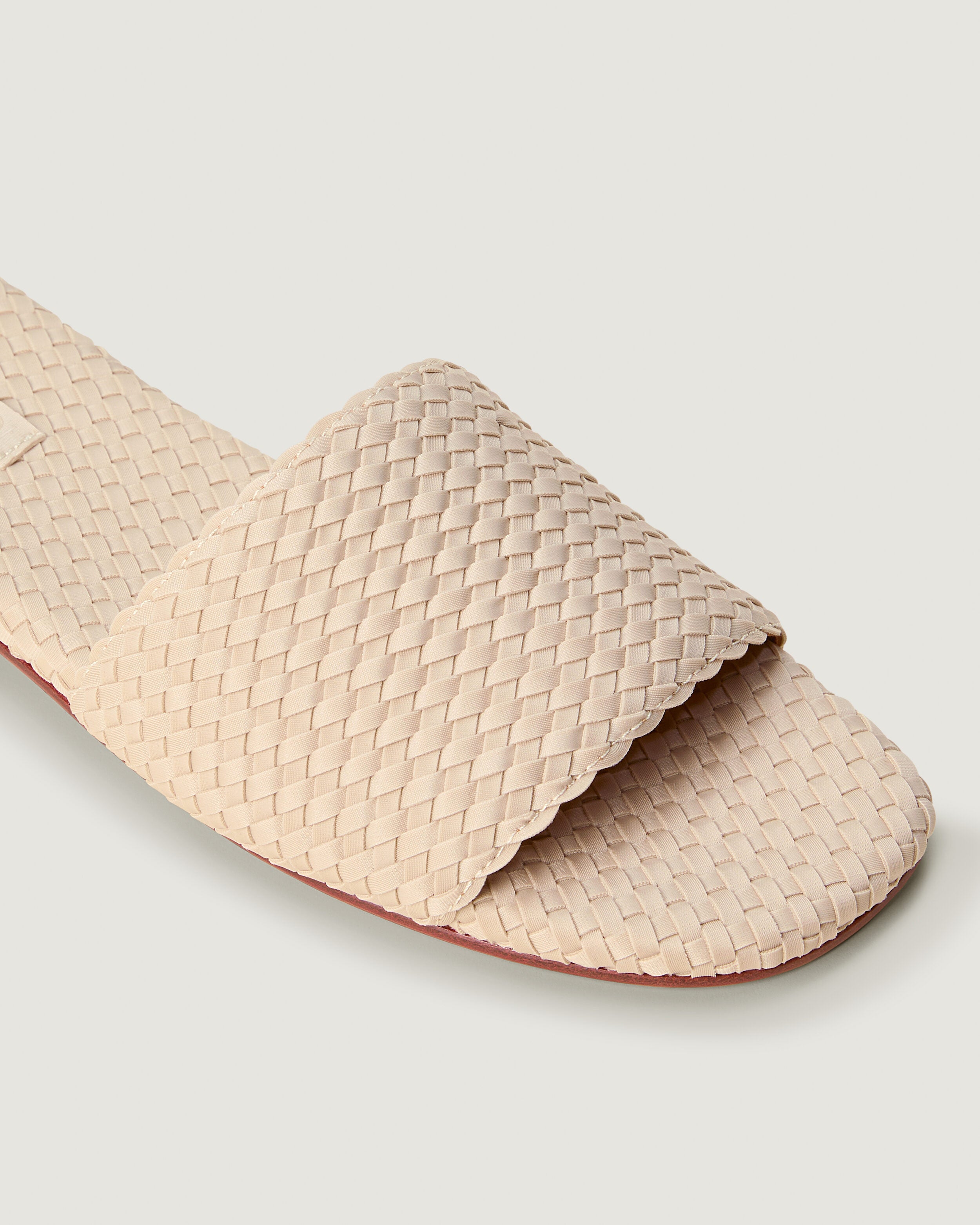 Close-up of The St. Barths Slide in Ecru showing its open toe and square silhouette.