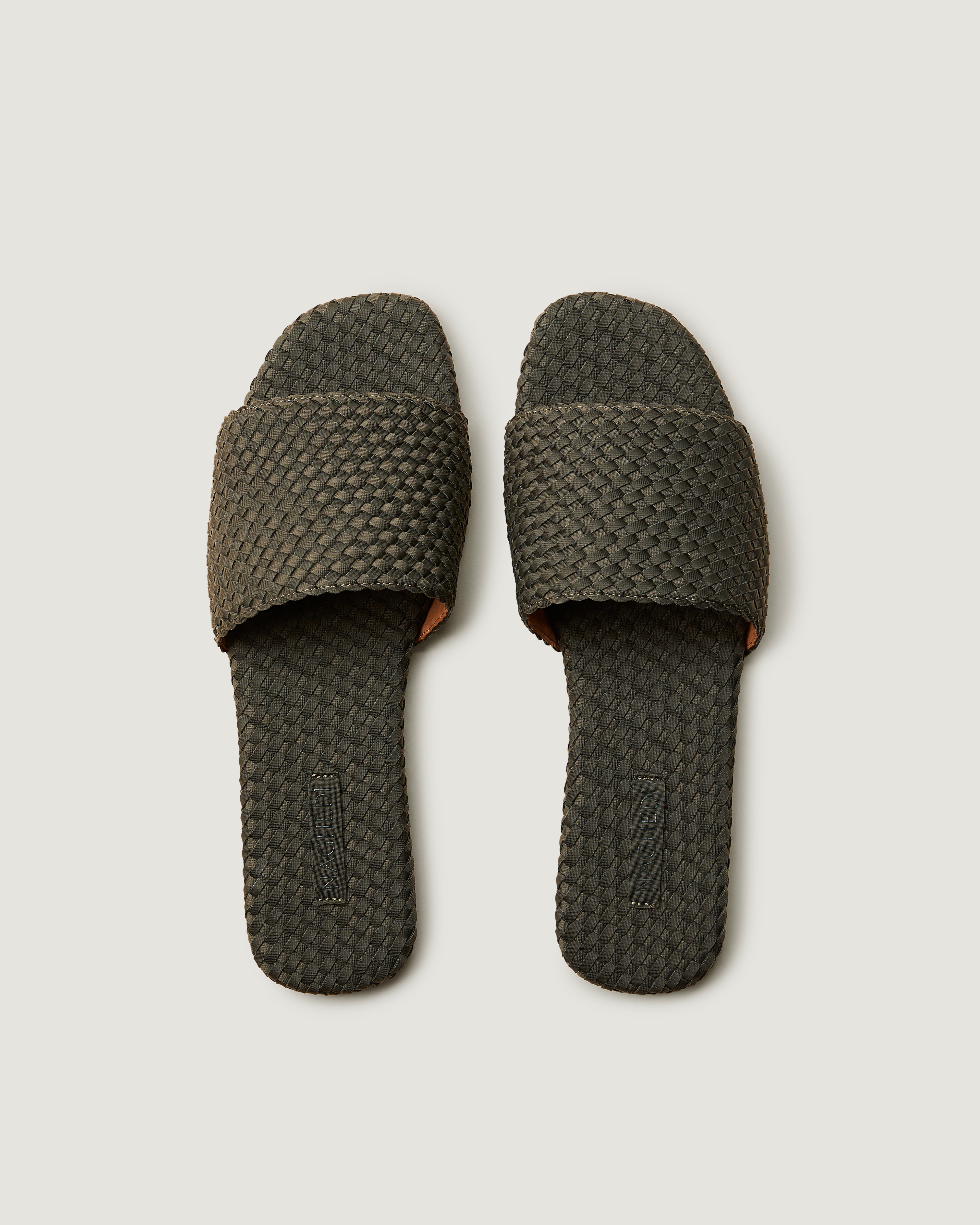 Top view of pair of The St. Barths Slide in Olive showing the handwoven neoprene insole.