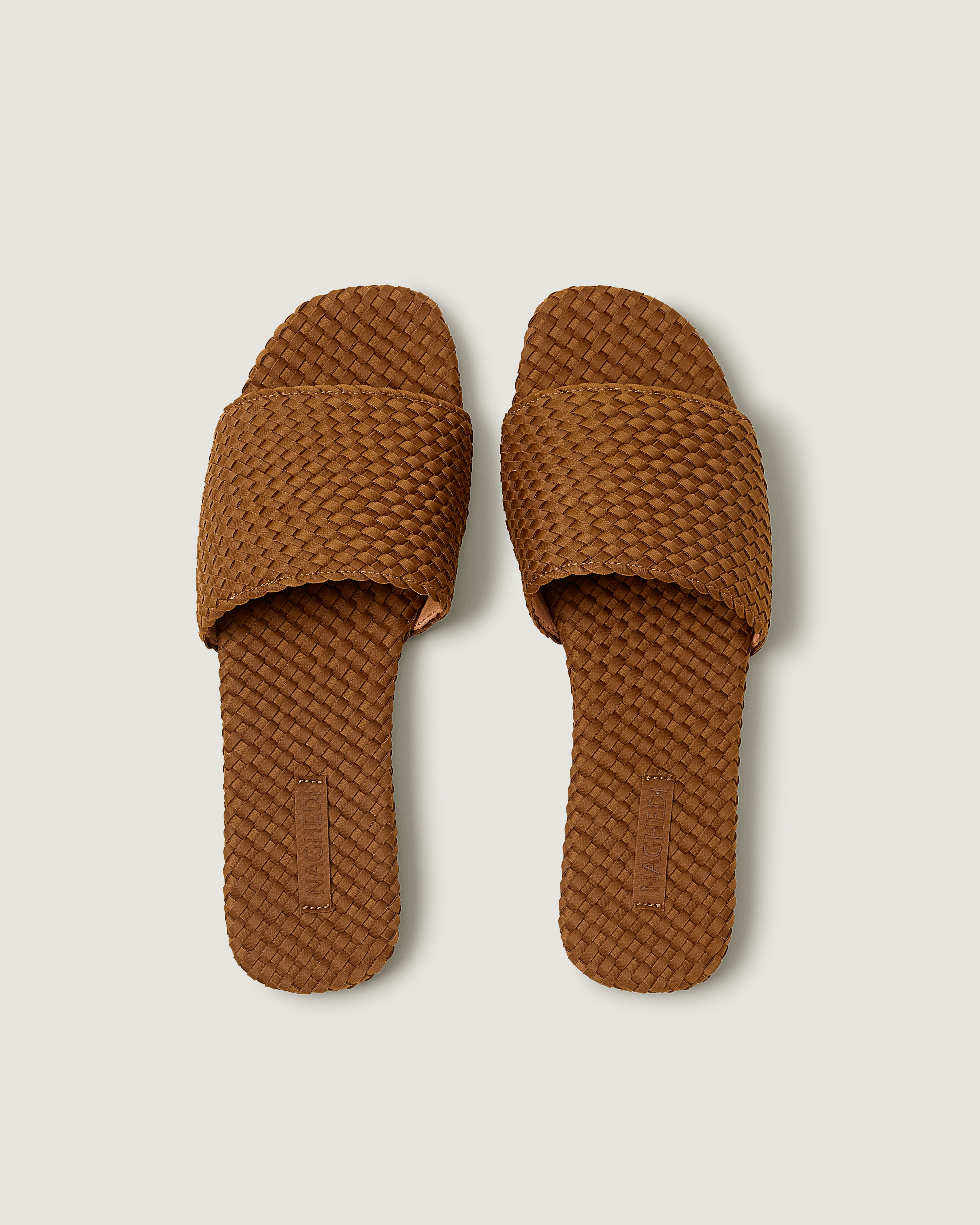 Top view of pair of The St. Barths Slide in Teak showing the handwoven neoprene insole.