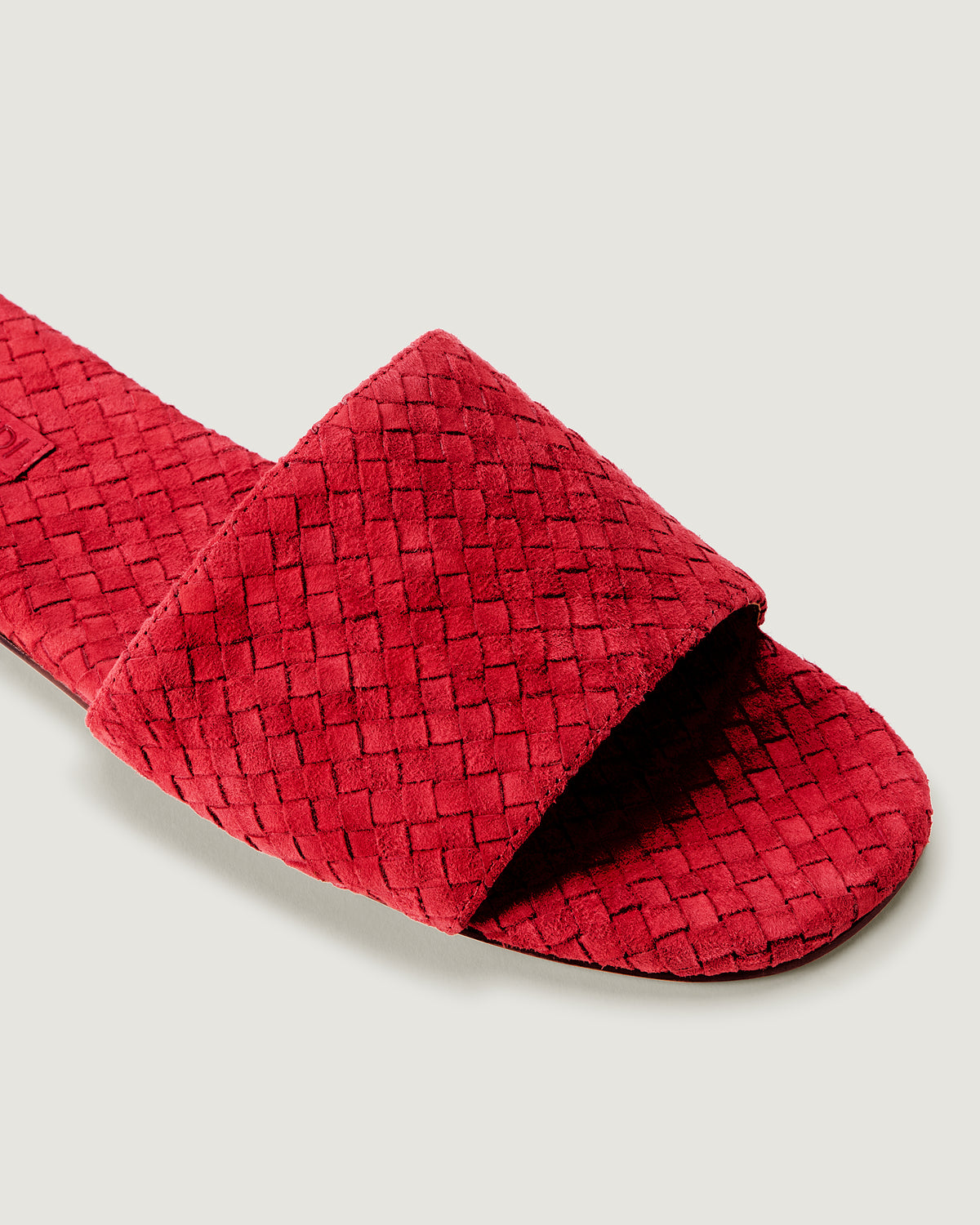 Close-up of The St. Barths Slide in Cerise showing its open toe and square silhouette.