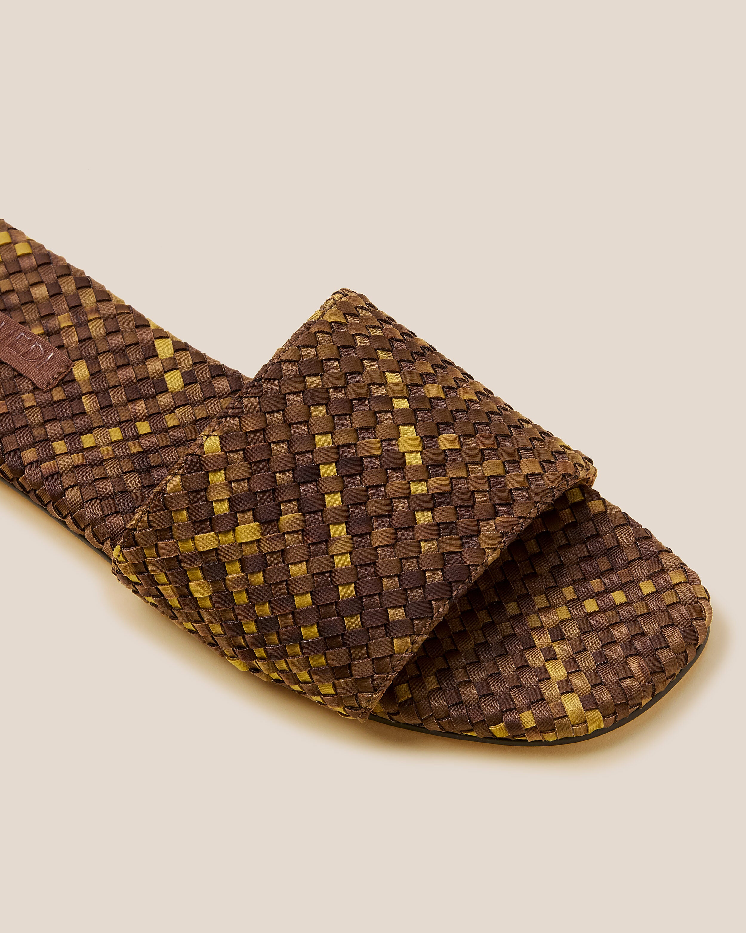 Close-up of The St. Barths Slide in Tortoiseshell showing its open toe and square silhouette.