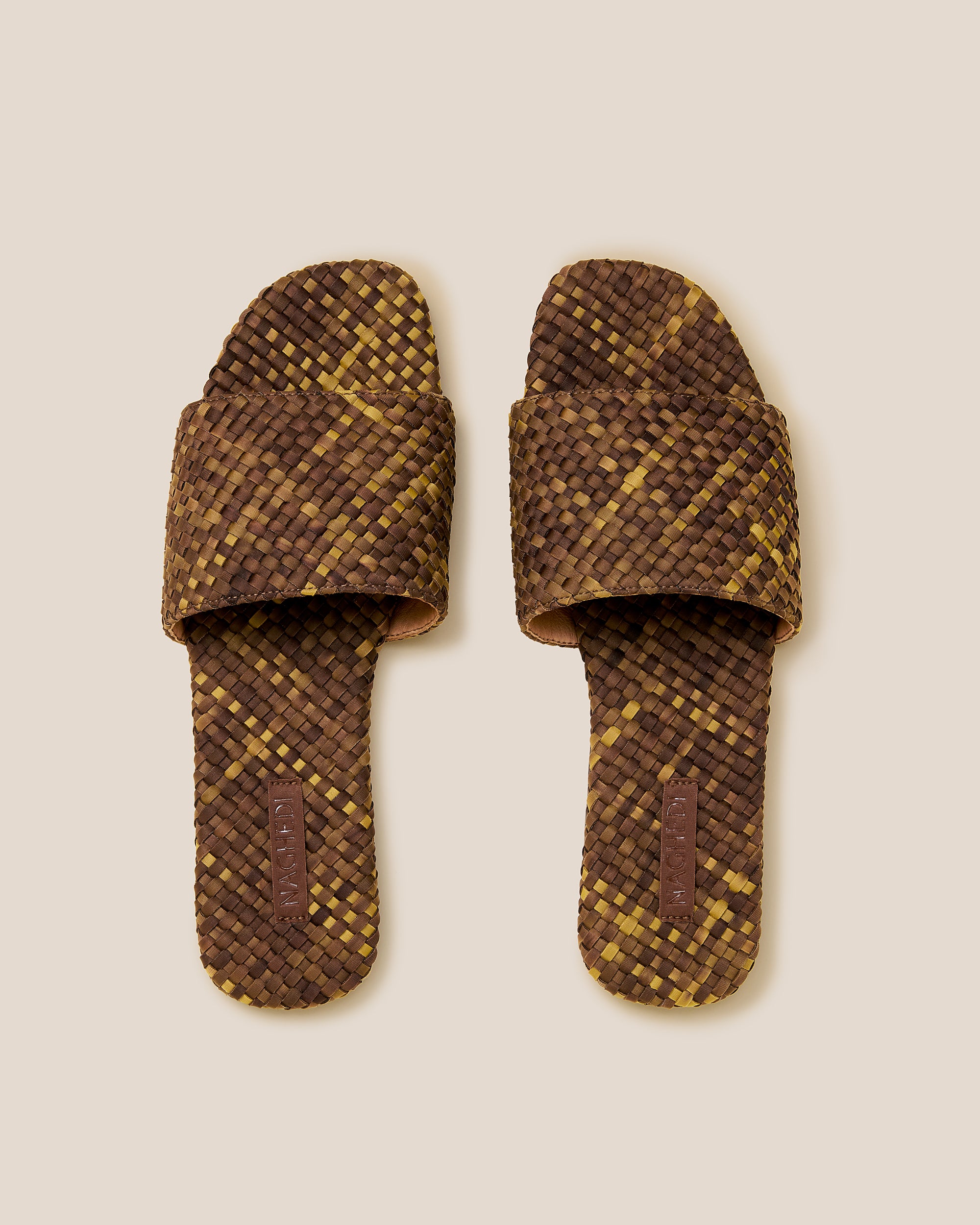 Top view of pair of St. Barths Watercolor Slide Sandals in Tortoiseshell showing the handwoven neoprene insole.