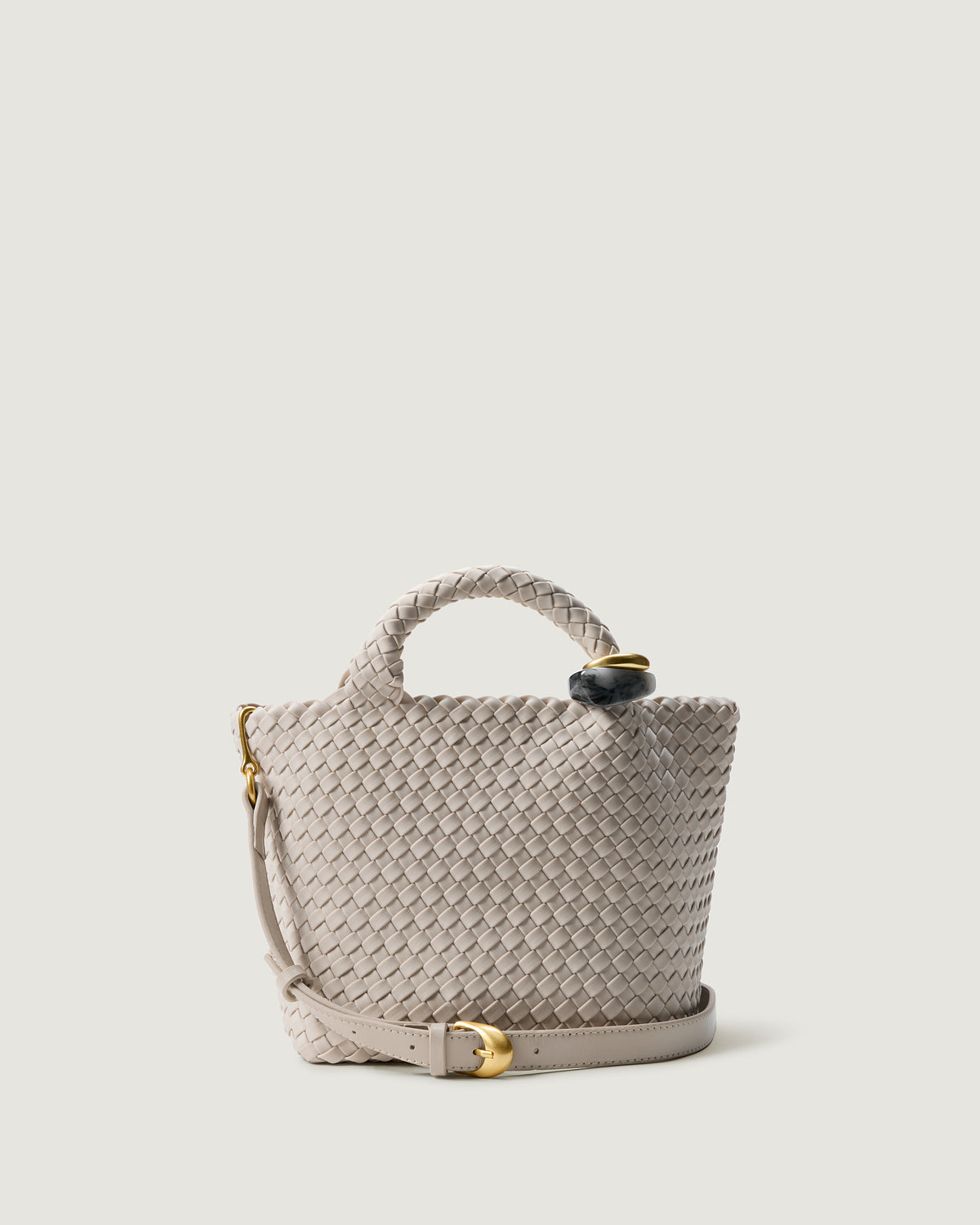 St. Barths Tote in Linen, an ivory tone, in handwoven neoprene, featuring an open top, beads on front handle, and leather strap.