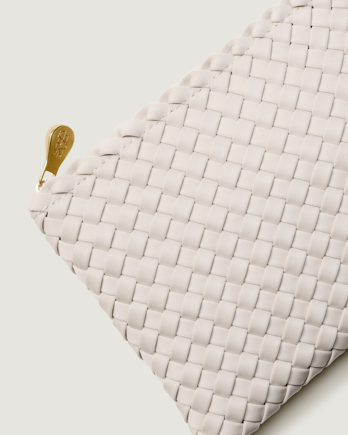 Close-up of included matching woven zippered pouch.