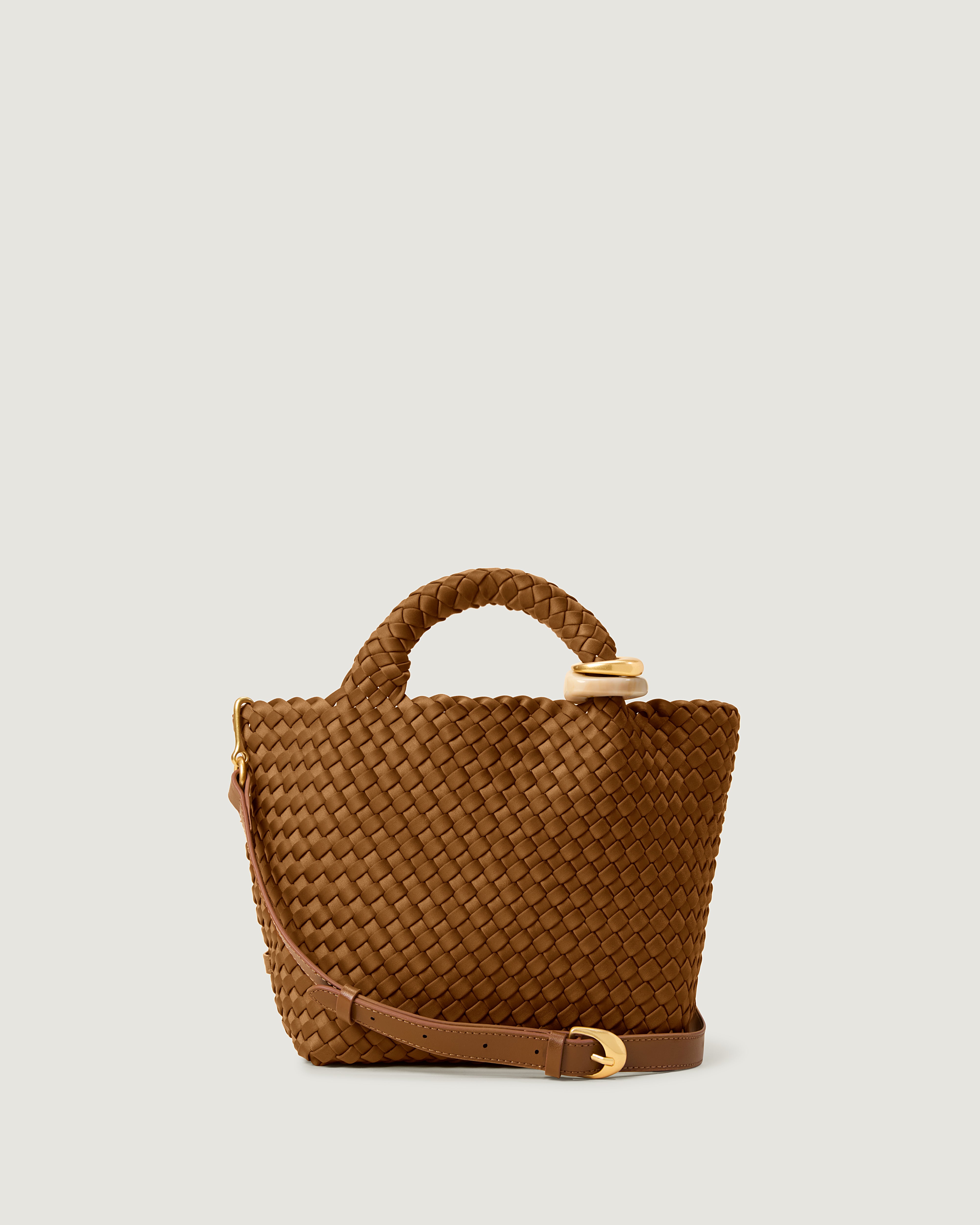 St. Barths Tote in Teak, a saddle brown tone, in handwoven neoprene, featuring an open top, beads on front handle, and leather strap.