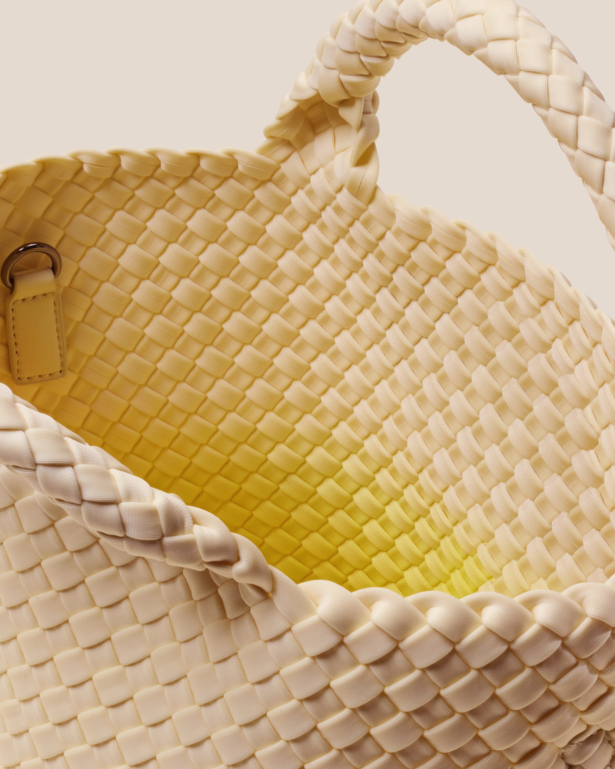 Interior close-up of St. Barths Tote in Ginkgo showing its open top, and unlined interior.