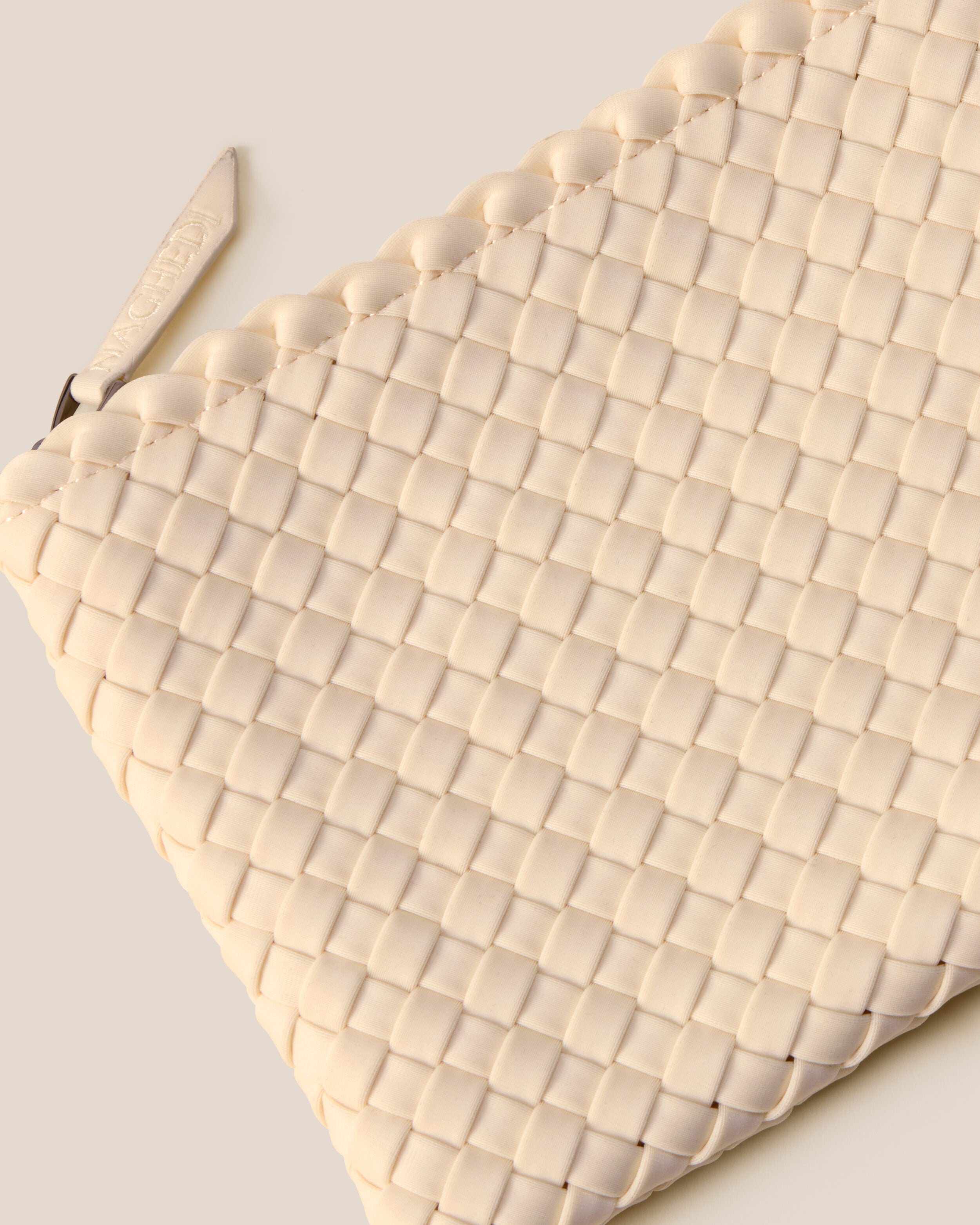 Close-up of included matching woven zippered pouch.