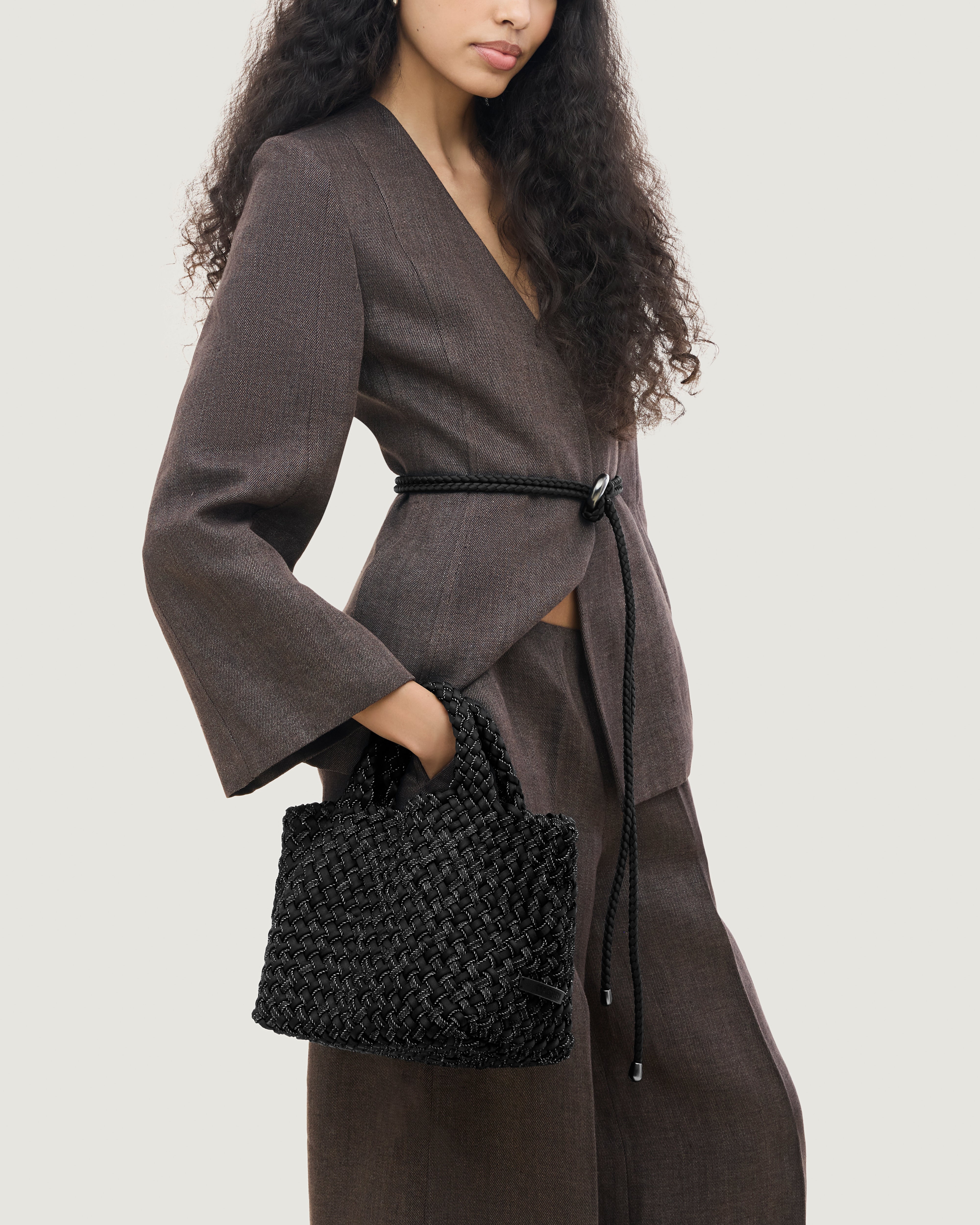 St. Barths Tote in Jet shown on model to illustrate scale and soft silhouette.
