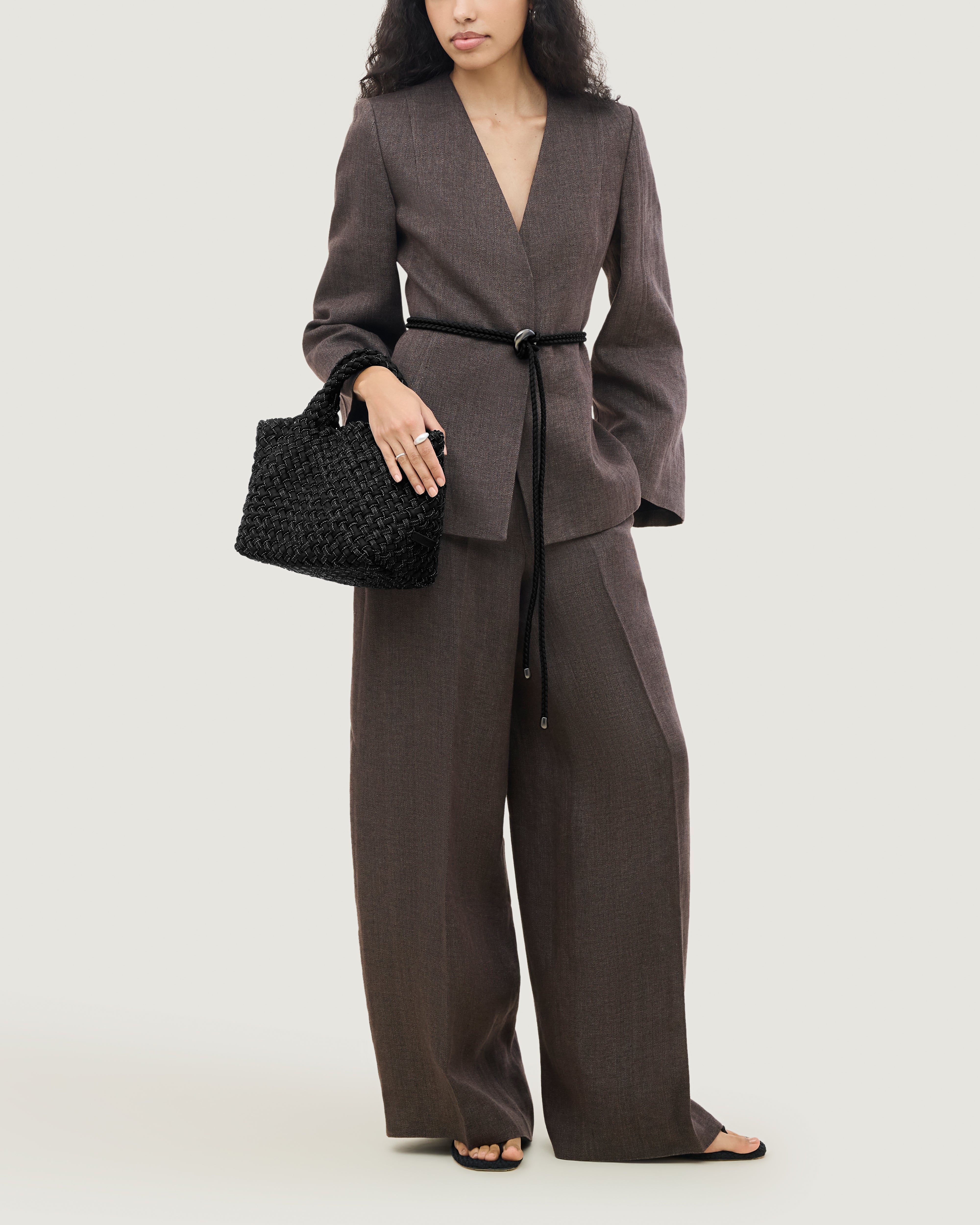 St. Barths Tote in Jet shown on model to illustrate scale and soft silhouette.