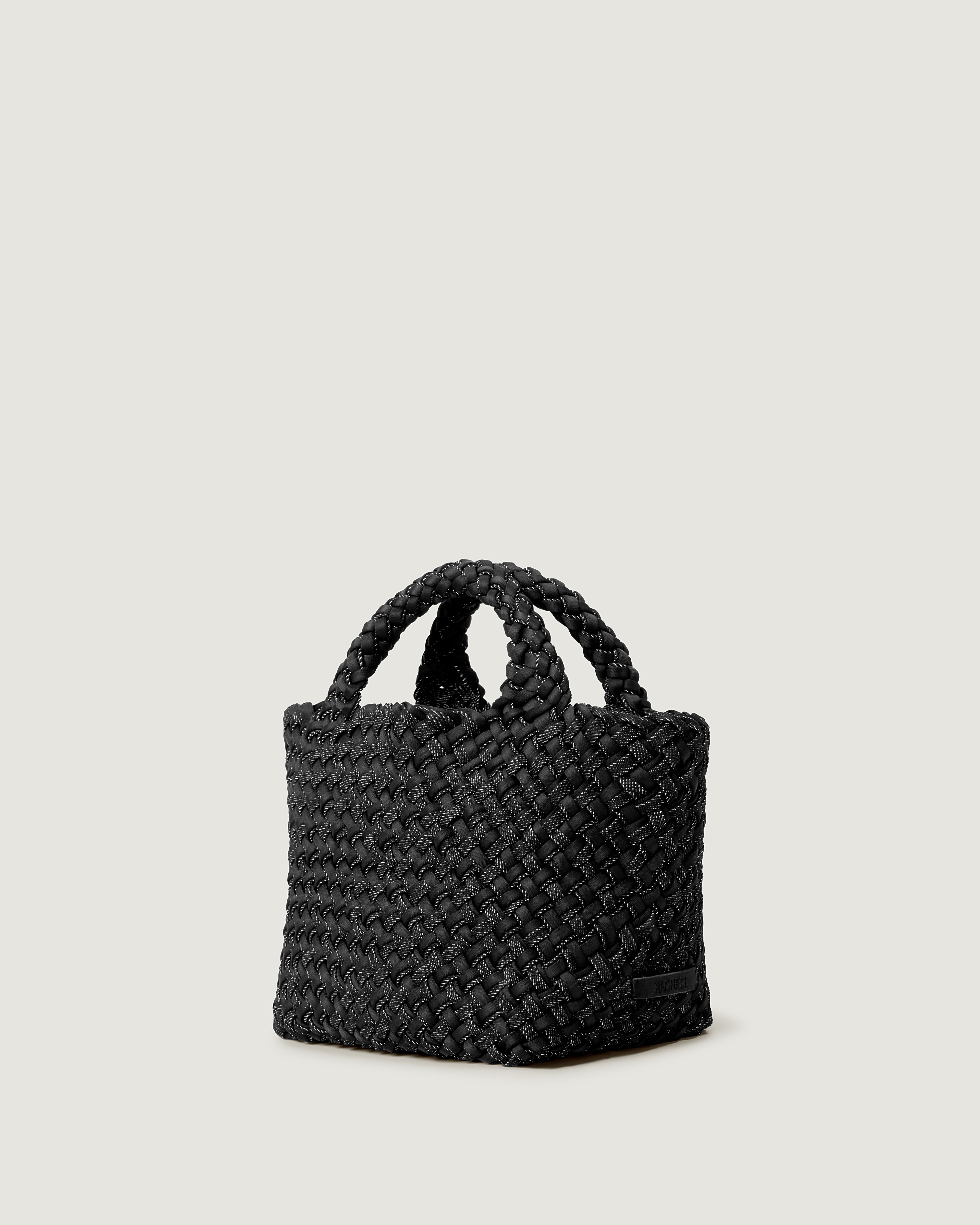 St. Barths Tote in Jet shown from a side angle, highlighting its handwoven double weave construction and open top.