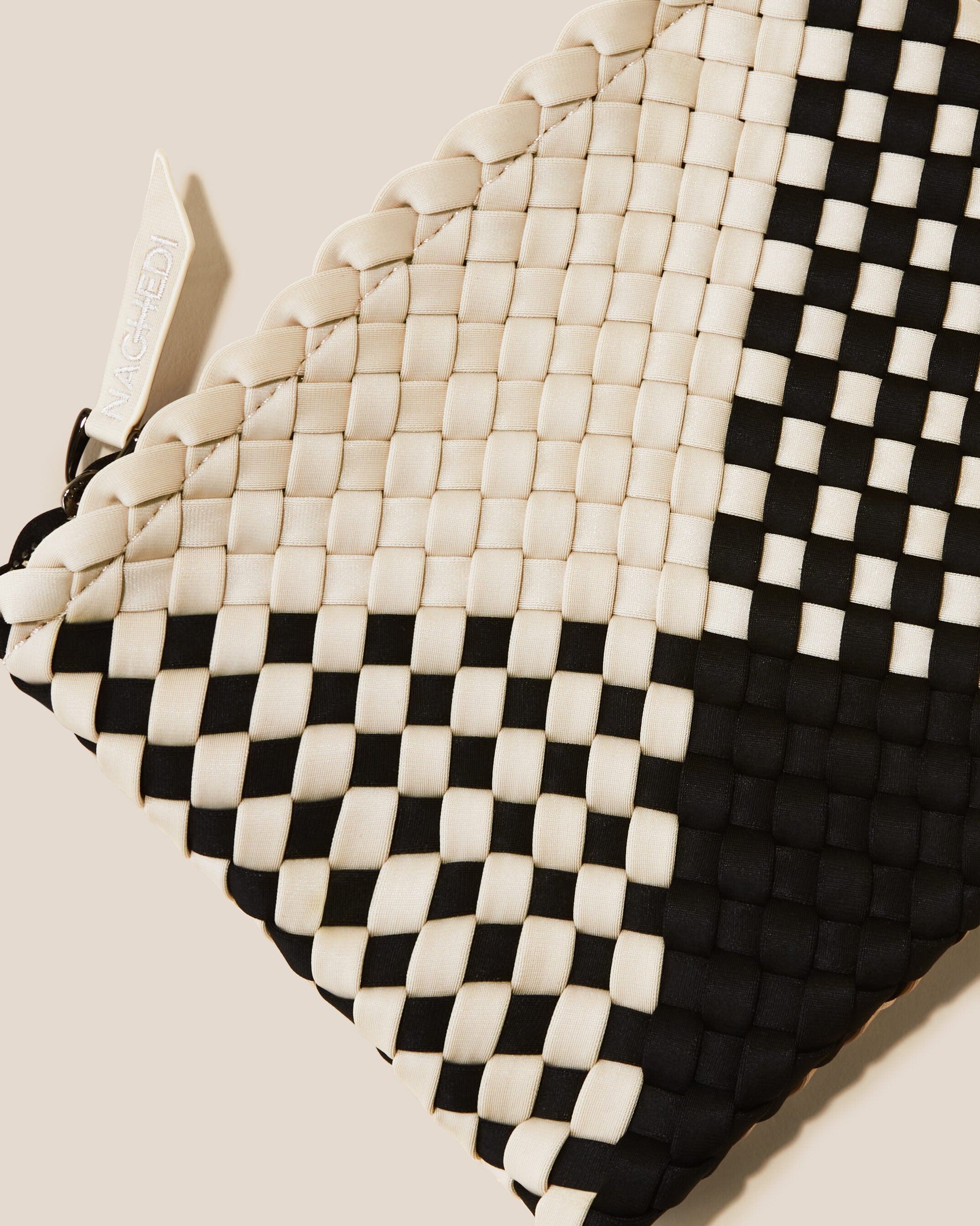 Close-up of included matching woven zippered pouch.