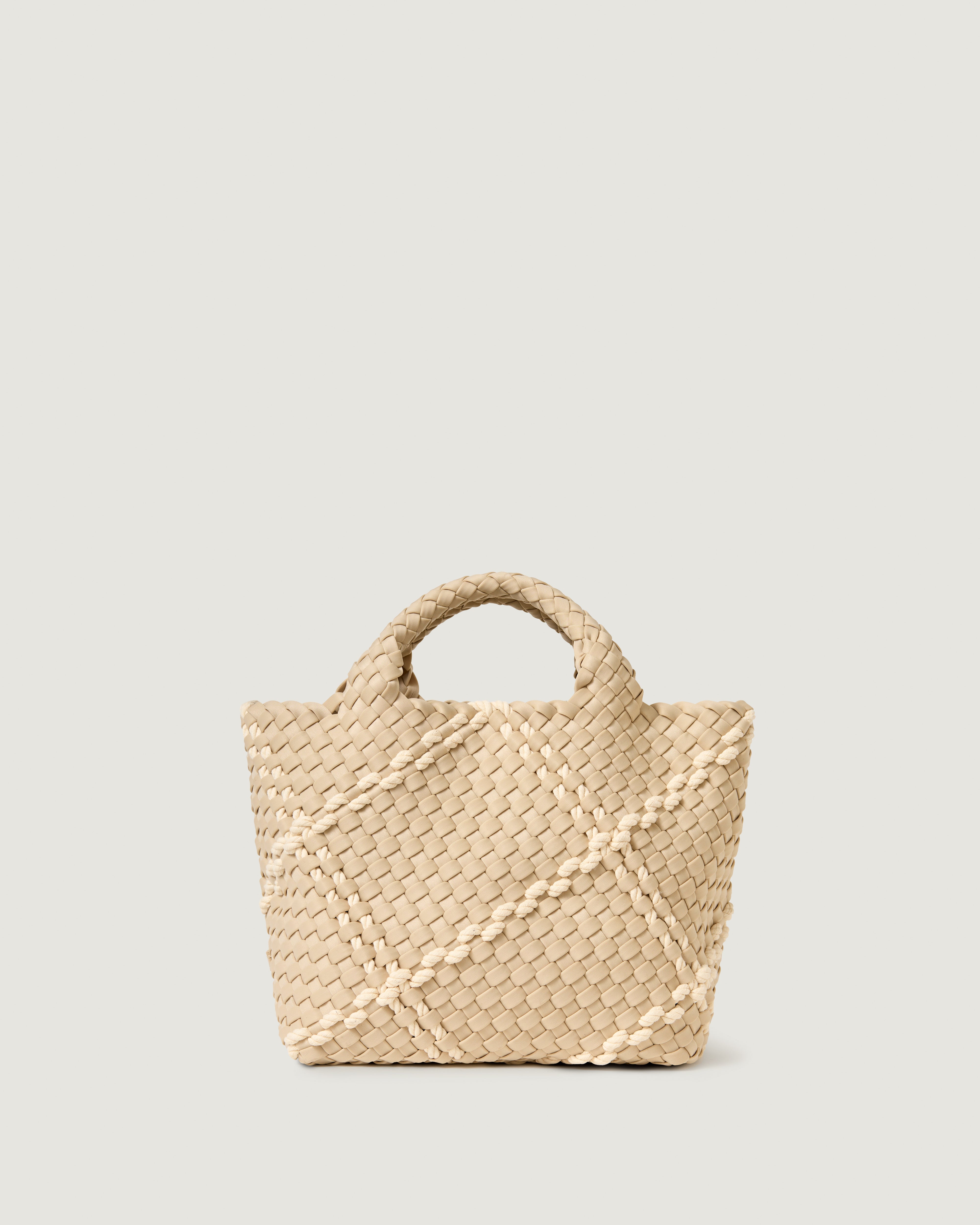 St. Barths Tote in Cable, a taupe tone, in handwoven neoprene, featuring an open top, woven top handles, and detachable, adjustable nylon crossbody strap.