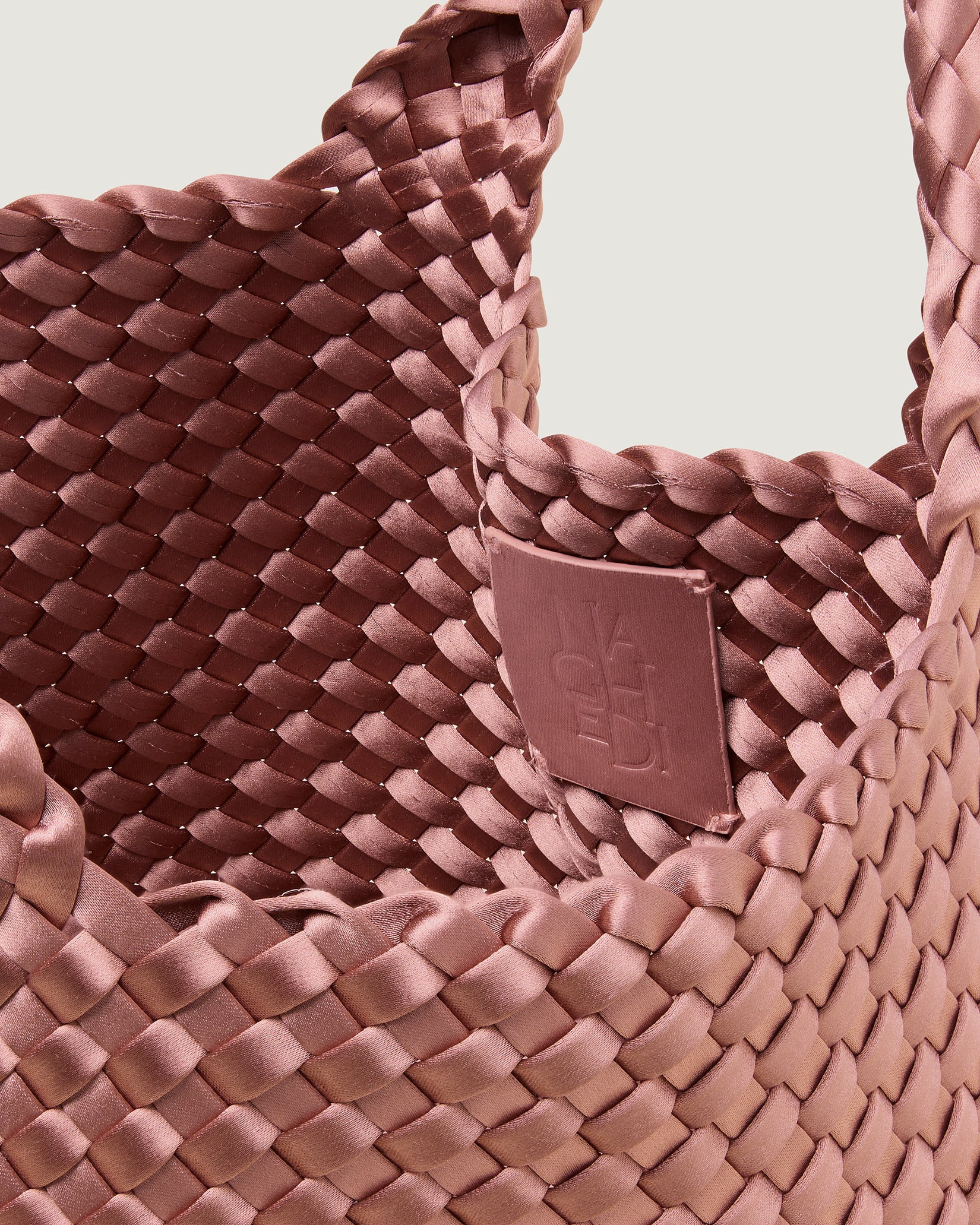 Interior close-up of St. Barths Small Satin Tote Bag in Daphne showing its open top, and unlined interior.