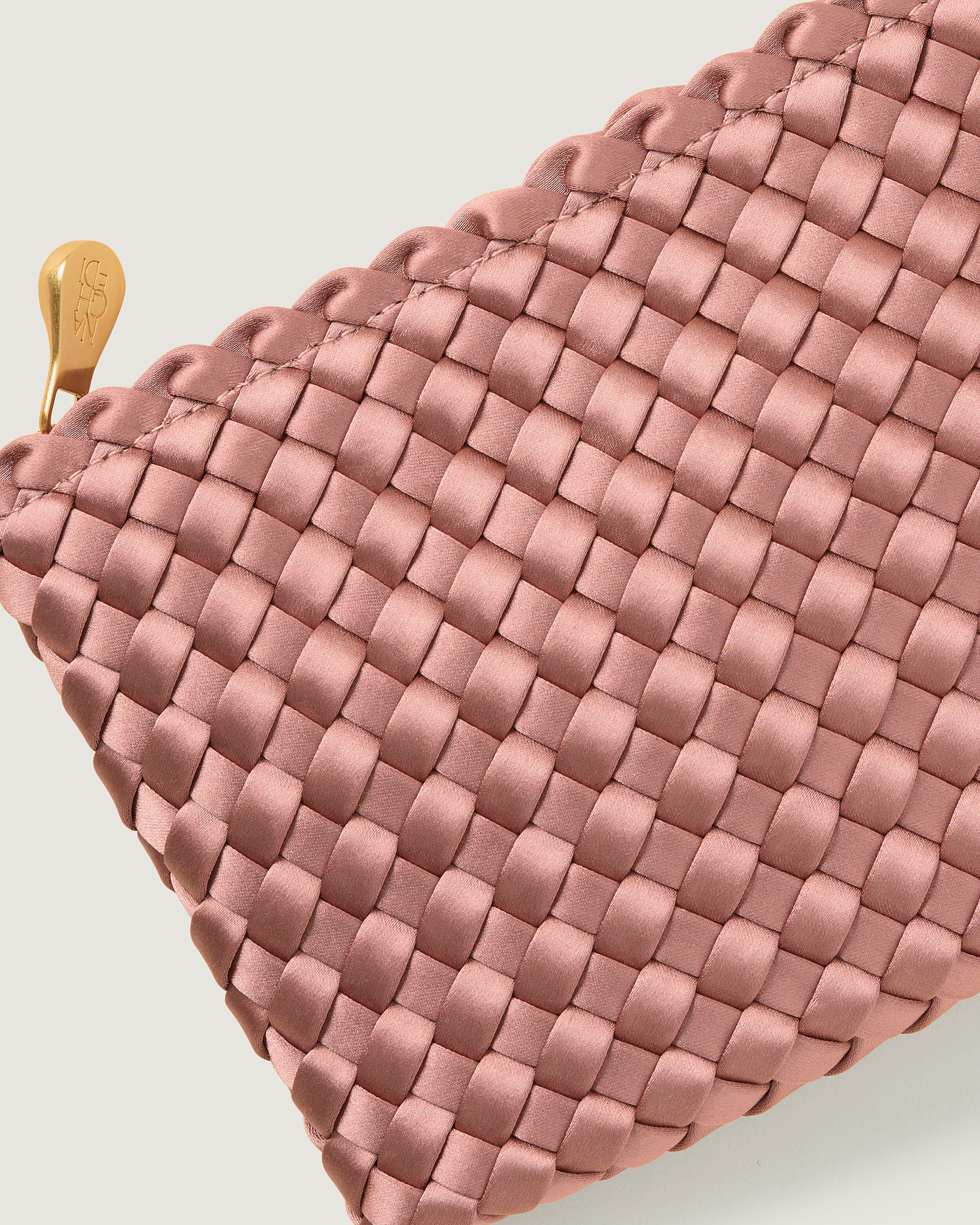 Close-up of included matching woven zippered pouch.