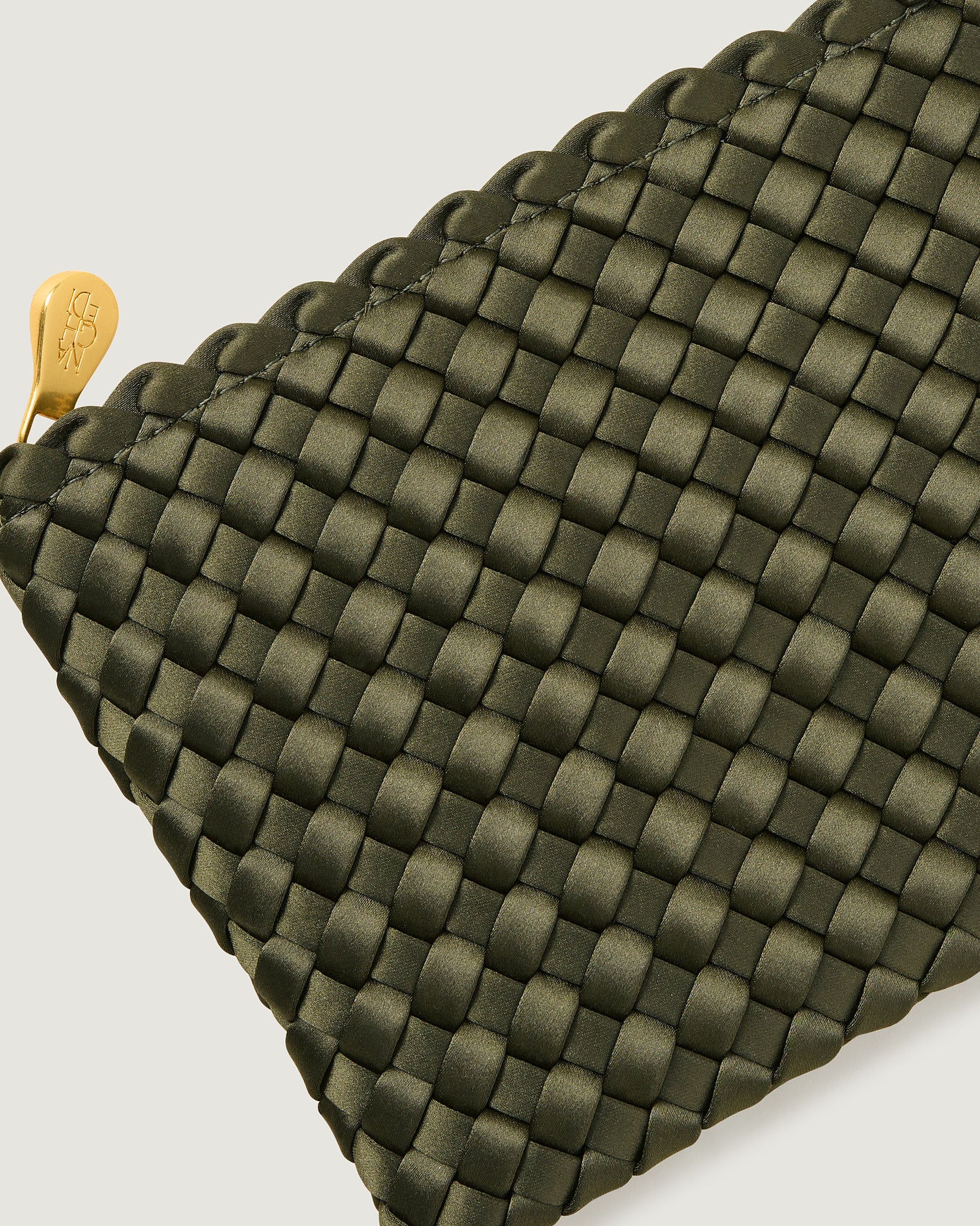 Close-up of included matching woven zippered pouch.