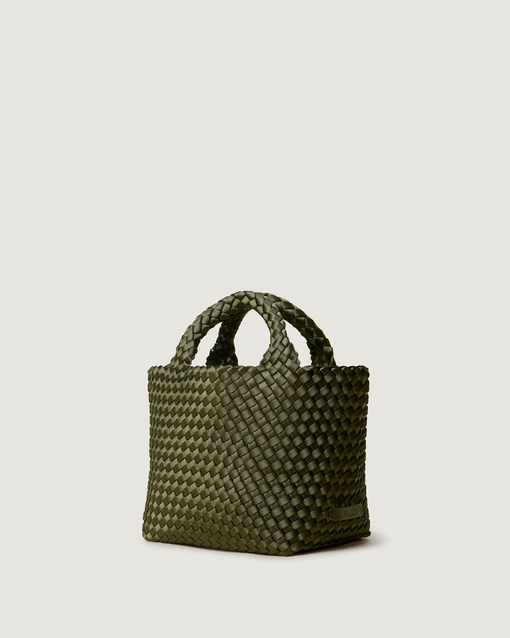 St. Barths Small Satin Tote Bag in Juniper shown from a side angle, highlighting its handwoven neoprene and open top.