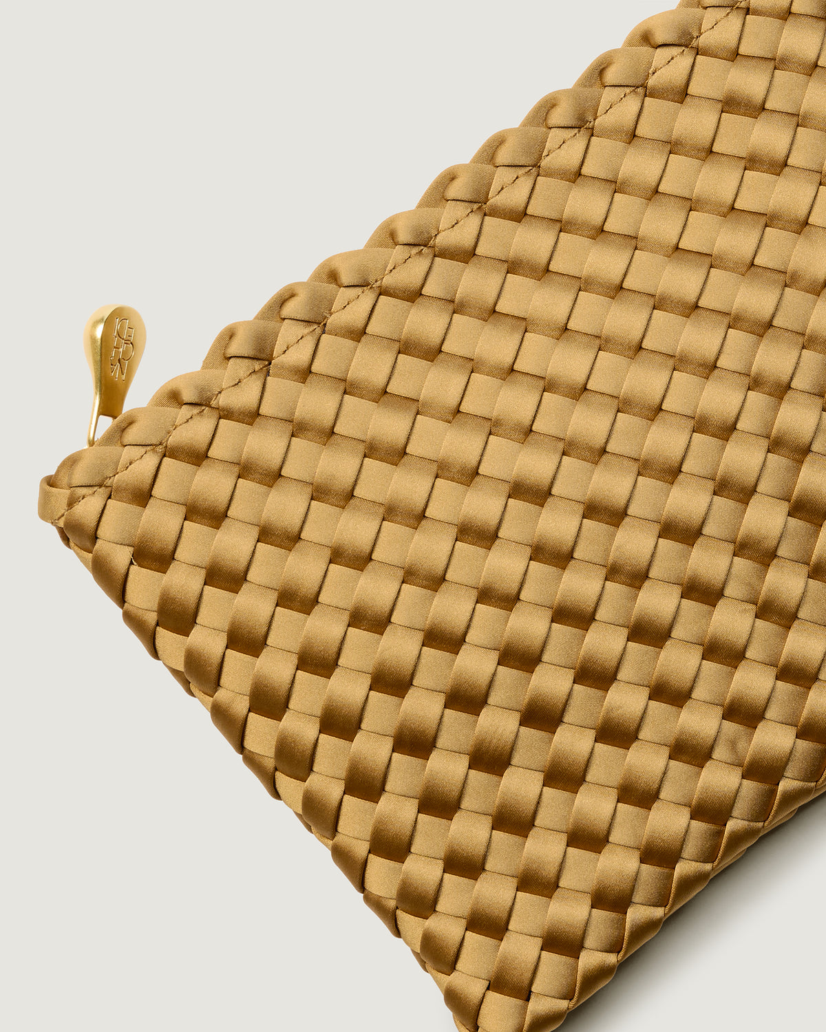 Close-up of included matching woven zippered pouch.