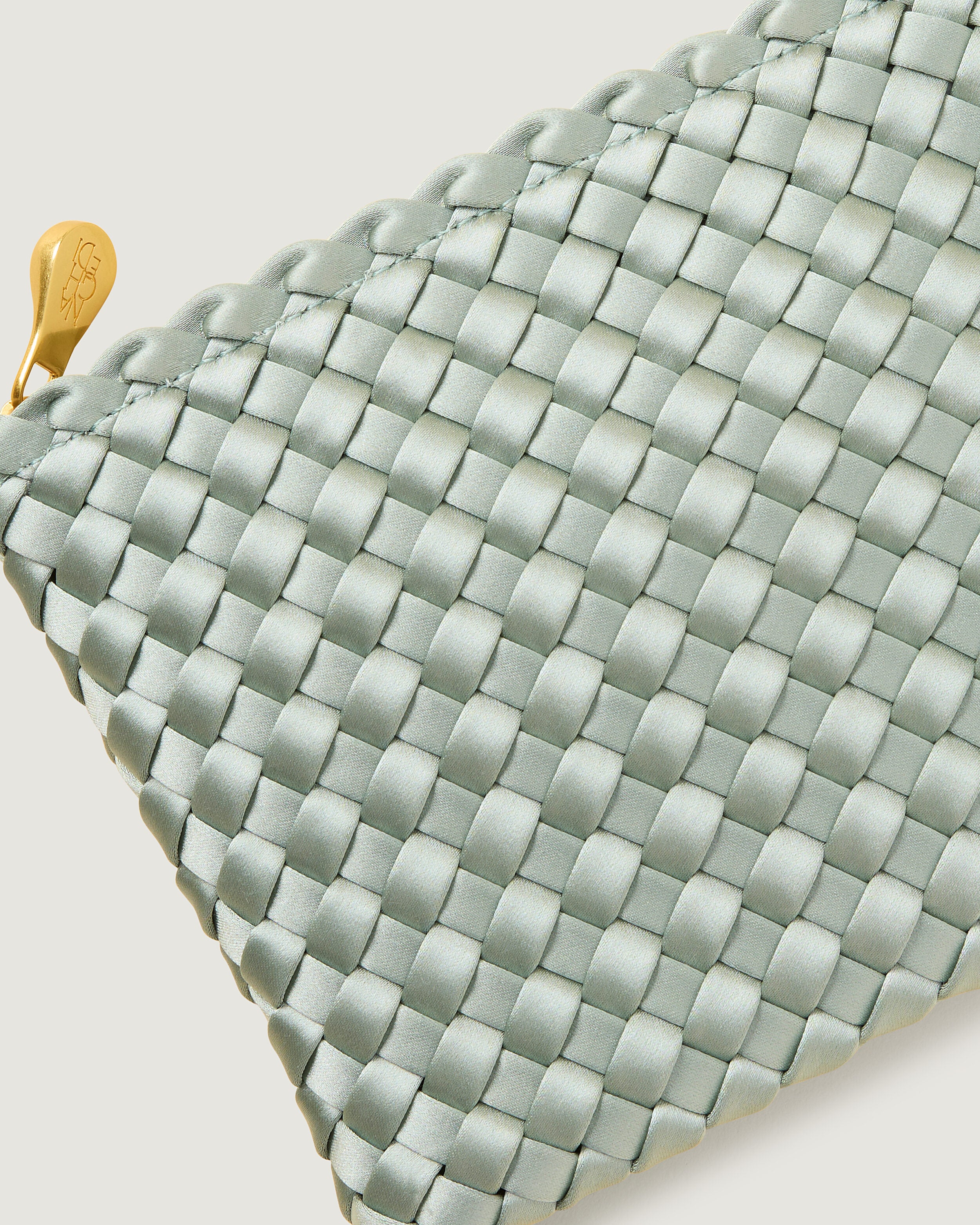 Close-up of included matching woven zippered pouch.