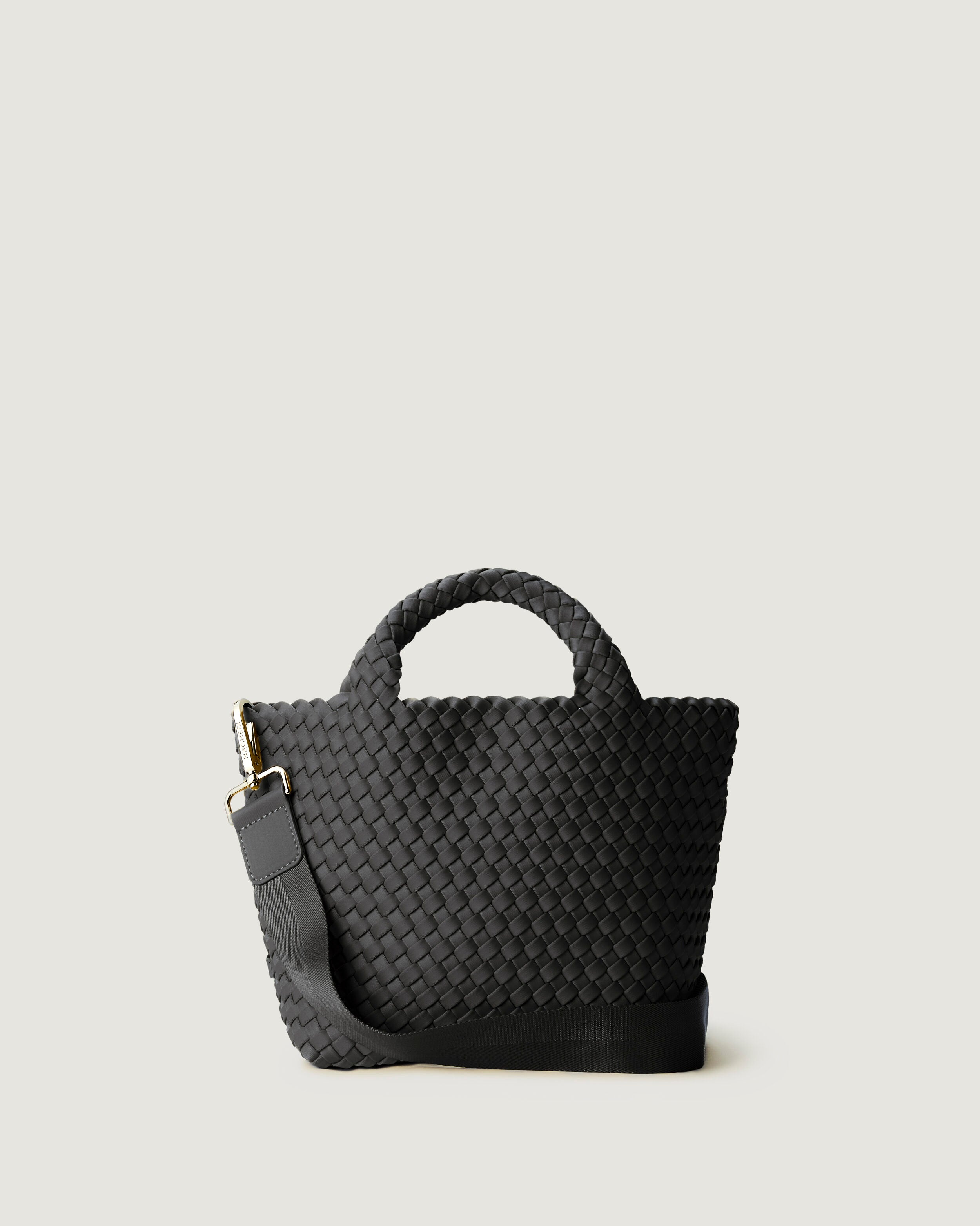 St. Barths Tote in Ash, a slate gray  tone, in handwoven neoprene, featuring an open top, woven top handles, and detachable, adjustable nylon crossbody strap.