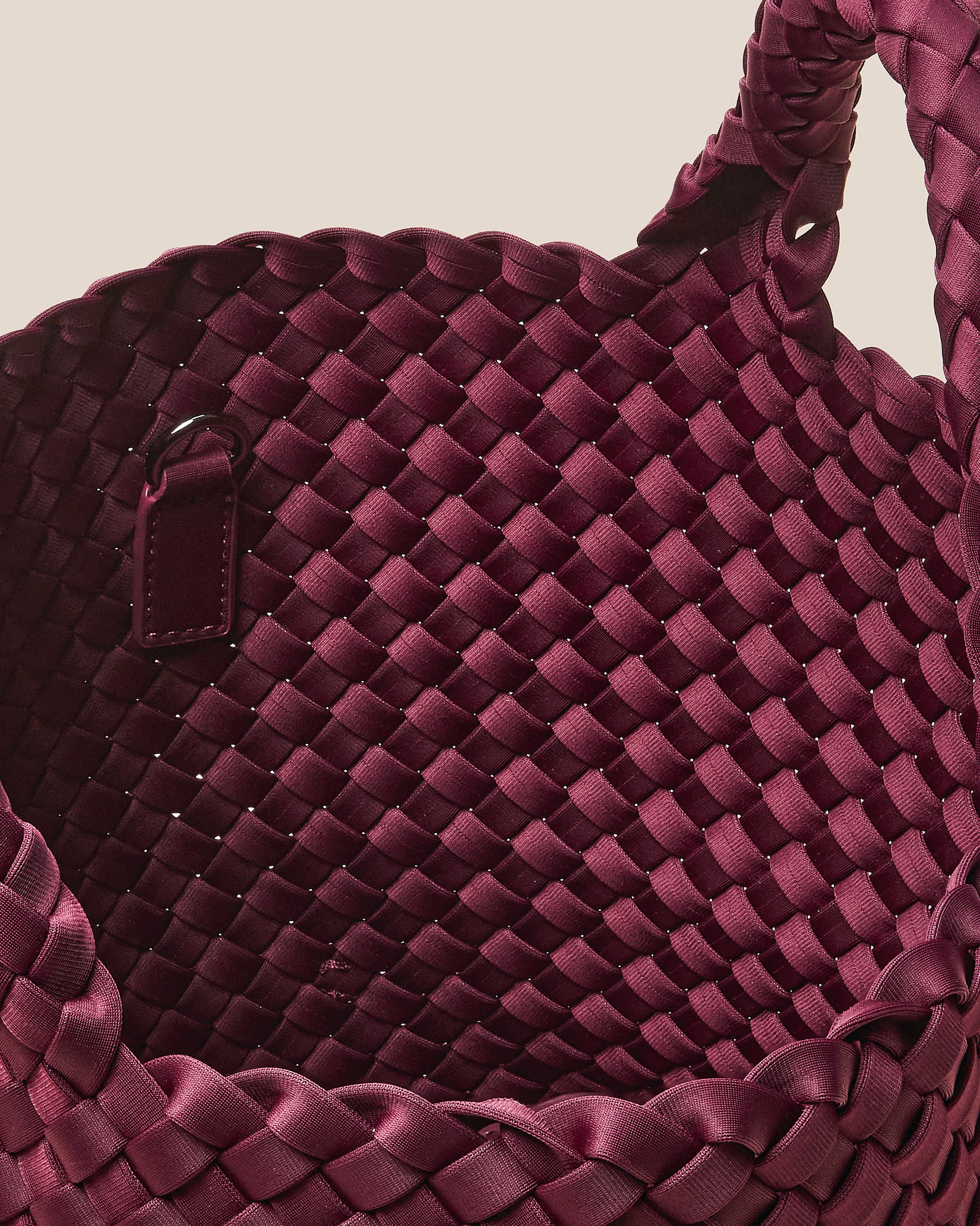 Interior close-up of St. Barths Small Tote Bag in Bordeaux showing its open top, and unlined interior.