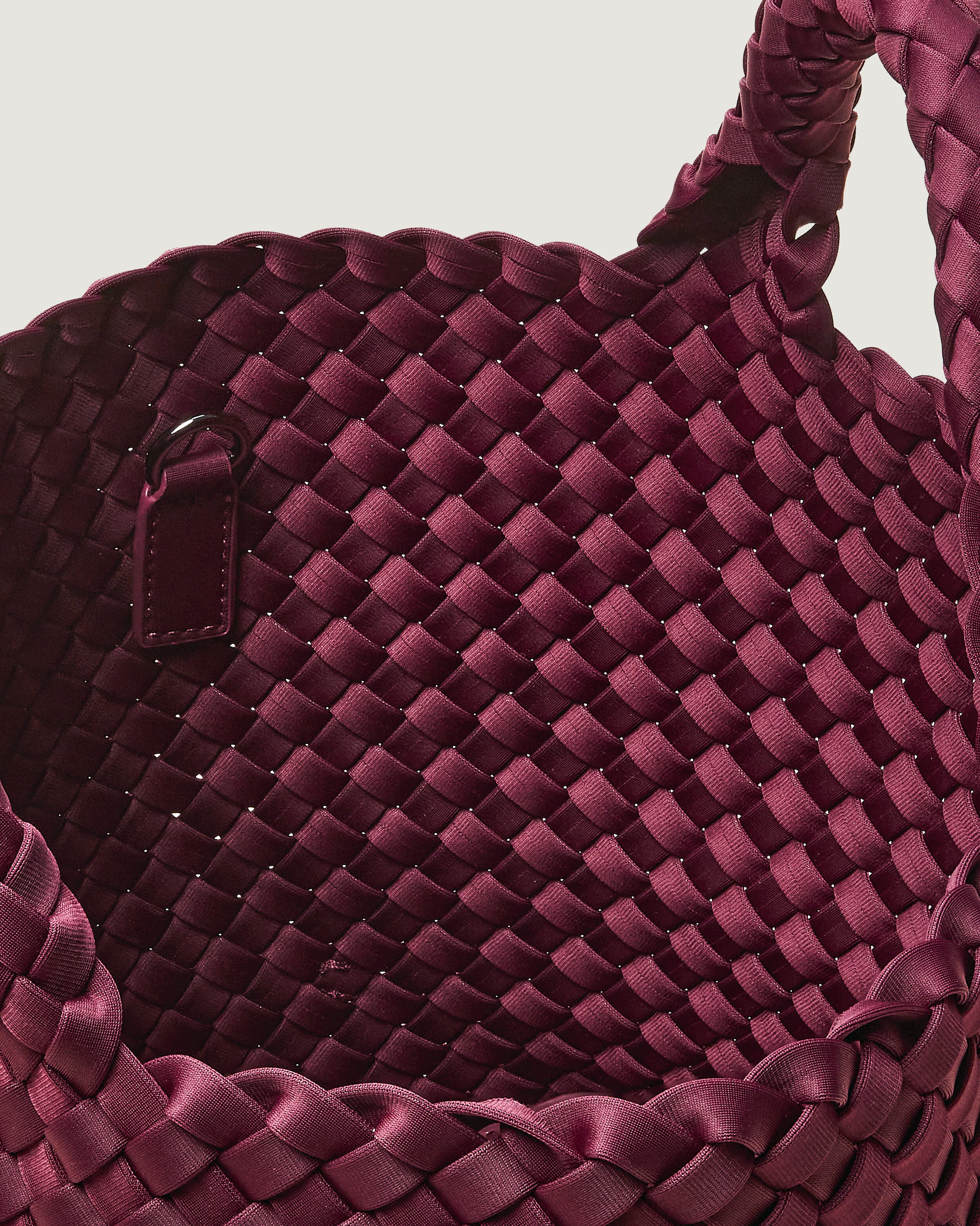 Interior close-up of St. Barths Tote in Bordeaux showing its open top, and unlined interior.