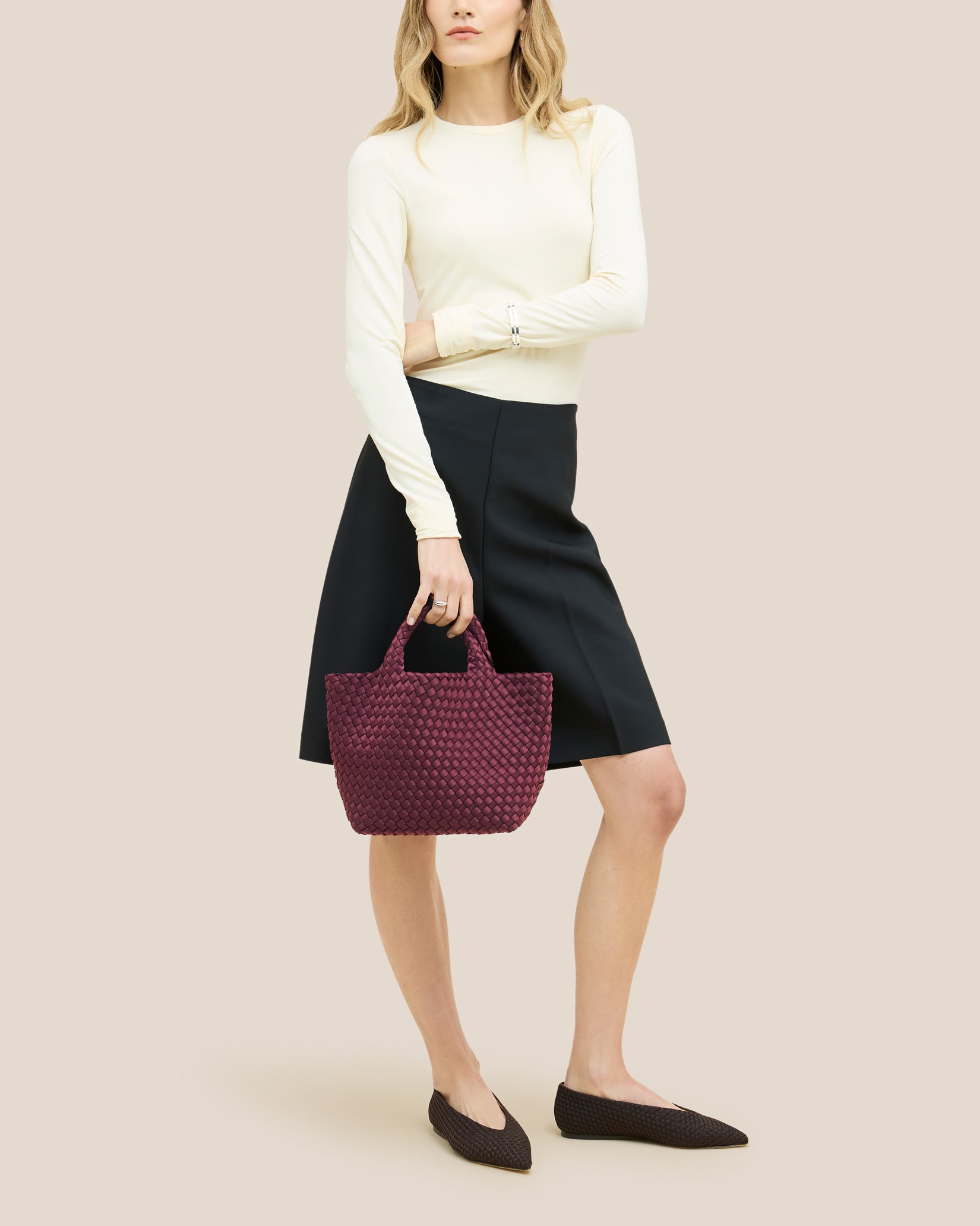 St. Barths Small Tote Bag in Bordeaux shown on model to illustrate scale and soft silhouette.