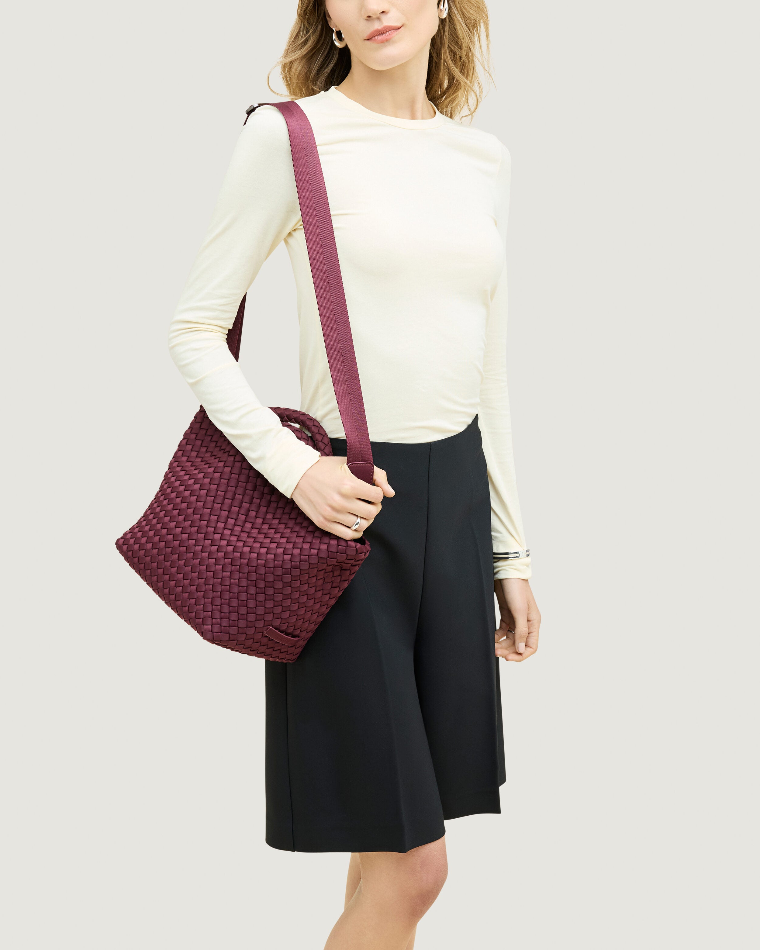 St. Barths Tote in Bordeaux shown on model to illustrate scale and soft silhouette.