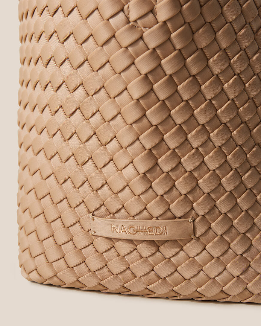 Close-up of stamped NAGHEDI logo on St. Barths Tote in Camel.