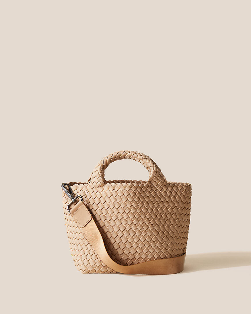 St. Barths Tote in Camel, a camel brown tone, in handwoven neoprene, featuring an open top, woven top handles, and detachable, adjustable nylon crossbody strap.
