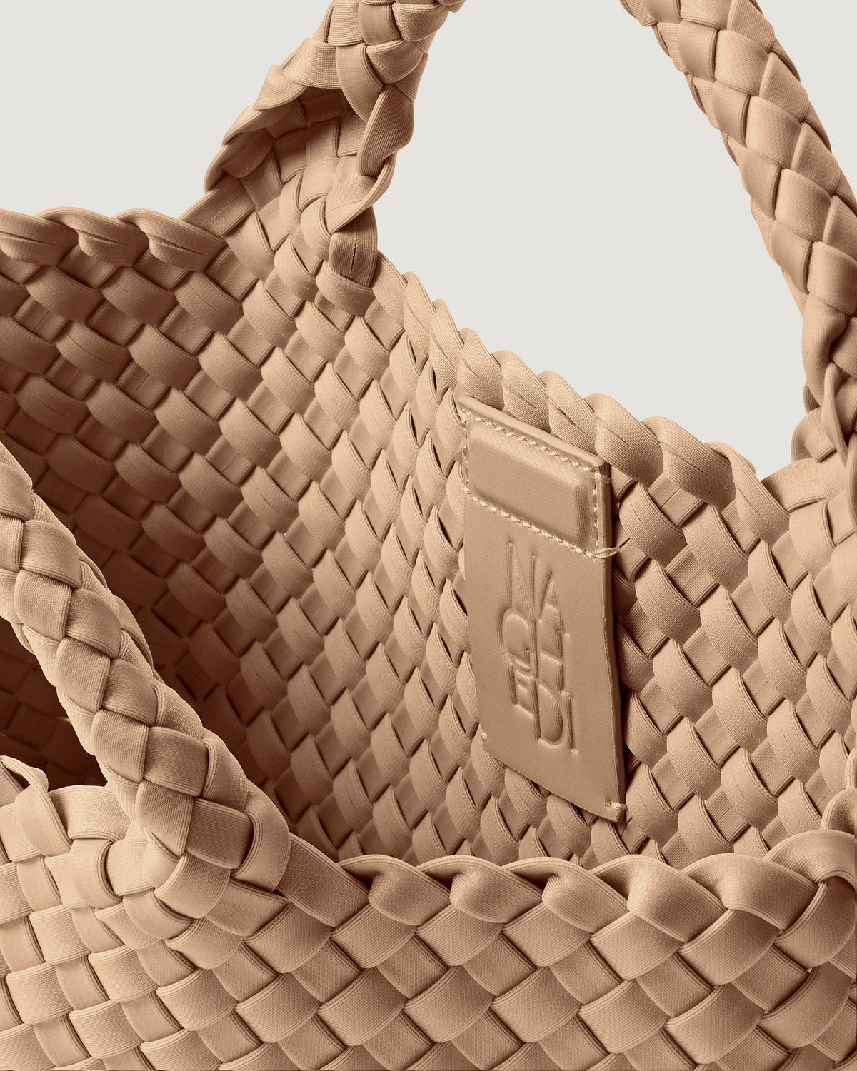 Interior close-up of St. Barths Tote in Camel showing its magnetic snap closure, and unlined interior.