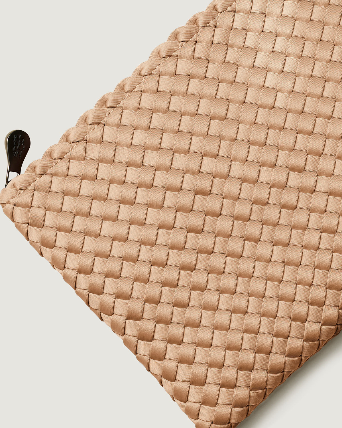 Close-up of included matching woven zippered pouch.