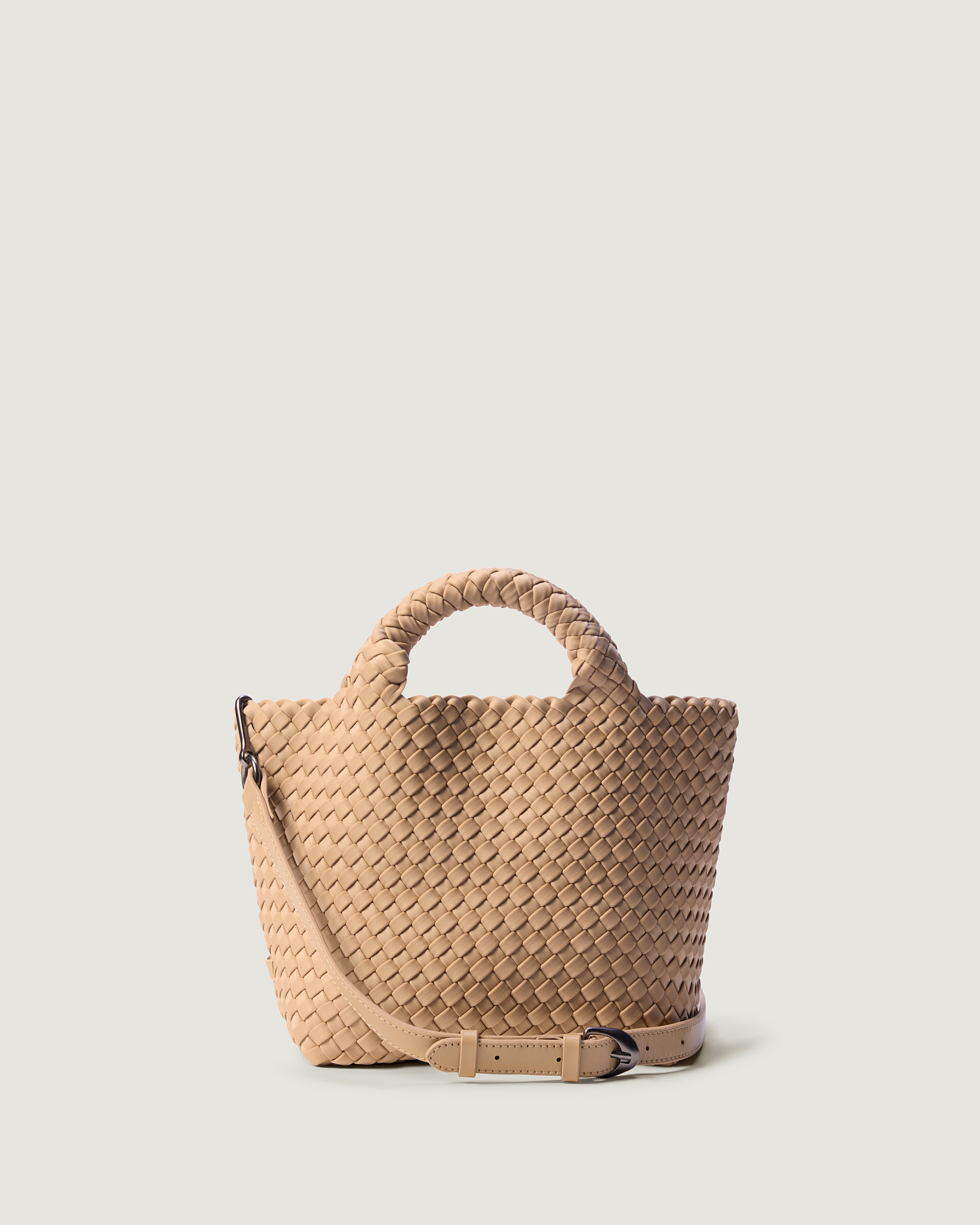 St. Barths Tote in Camel, a camel brown tone, in handwoven neoprene, featuring a magnetic closure woven top handles, and detachable, adjustable leather crossbody strap.