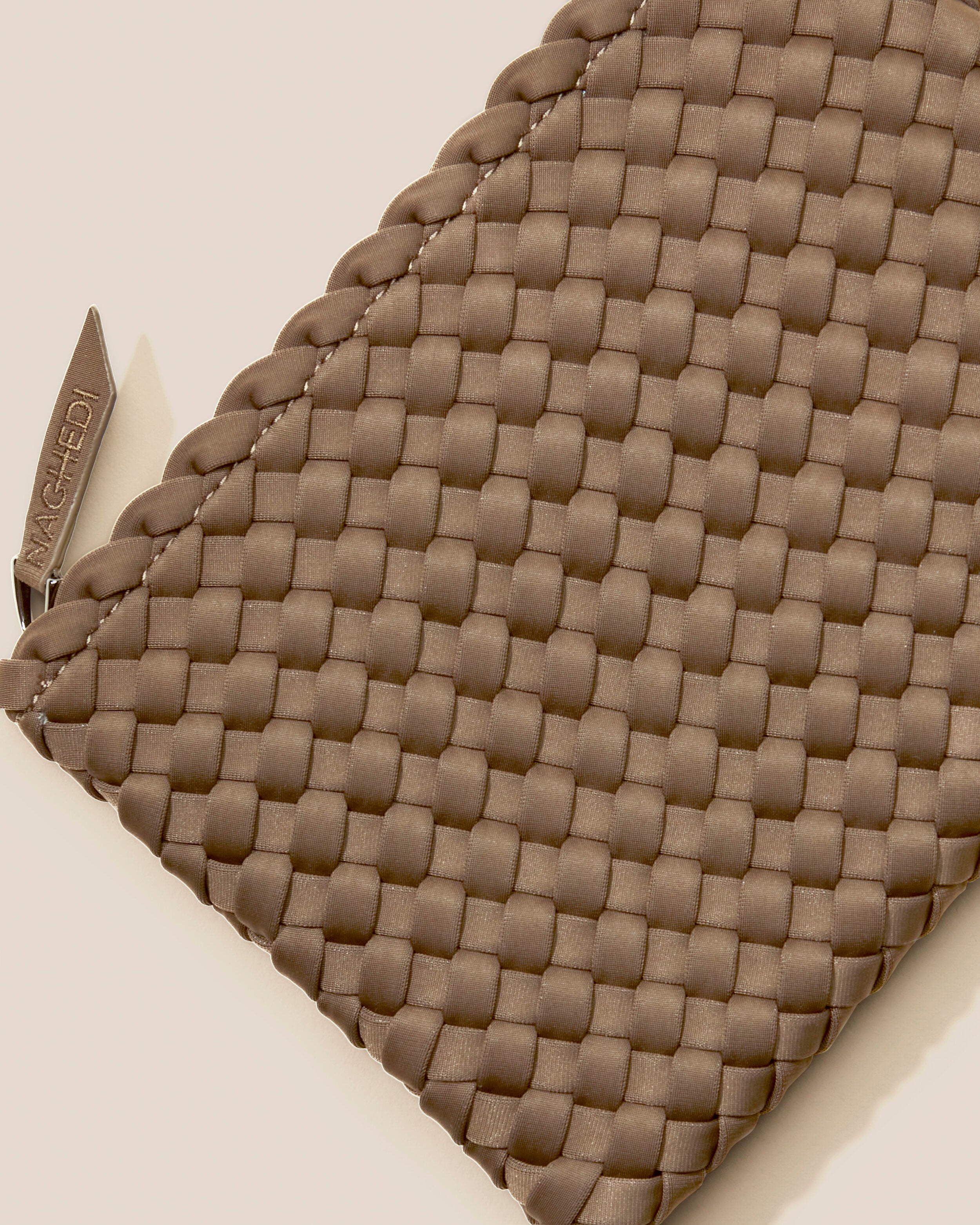 Close-up of included matching woven zippered pouch.