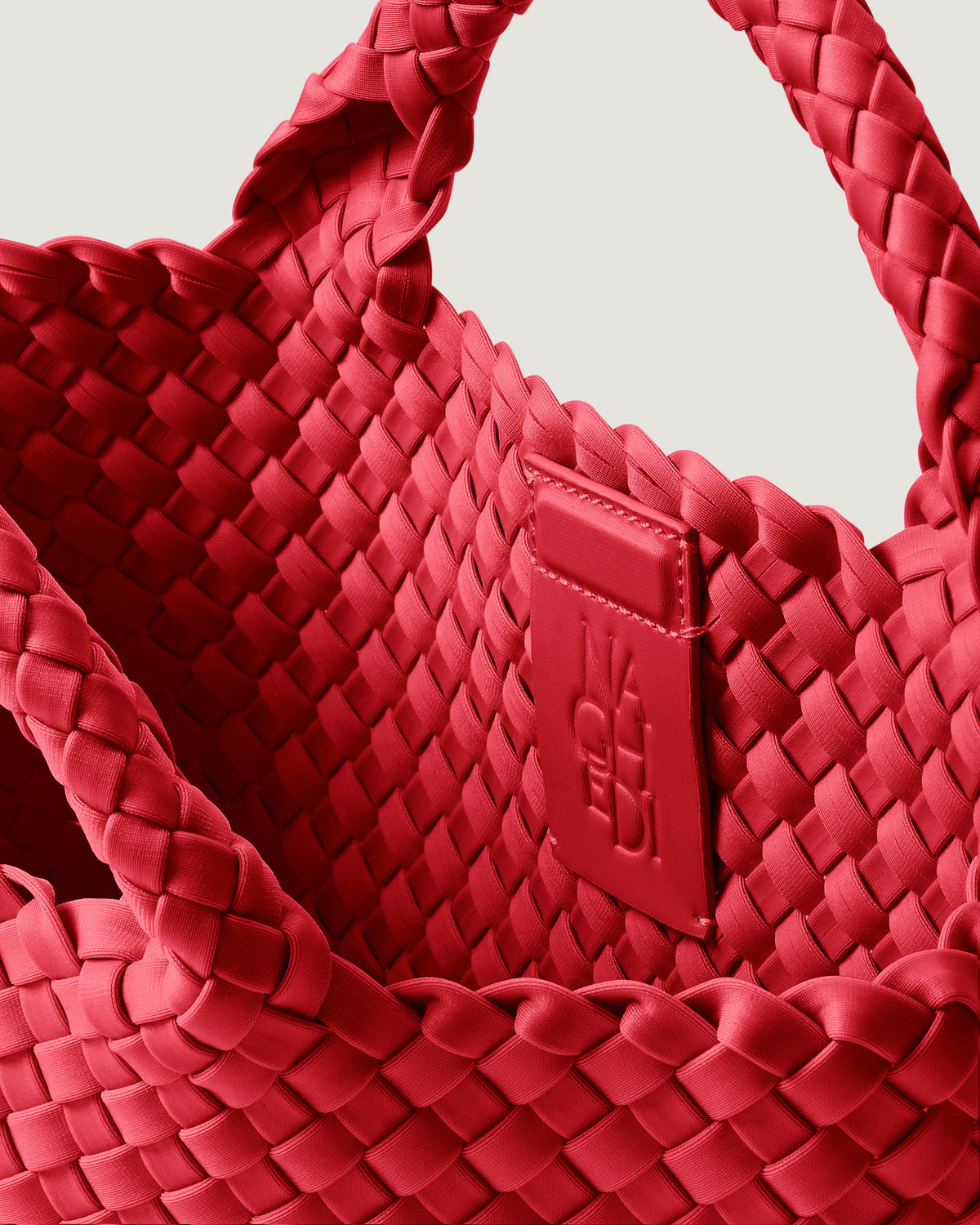 Interior close-up of St. Barths Tote in Cerise showing its magnetic snap closure, and unlined interior.