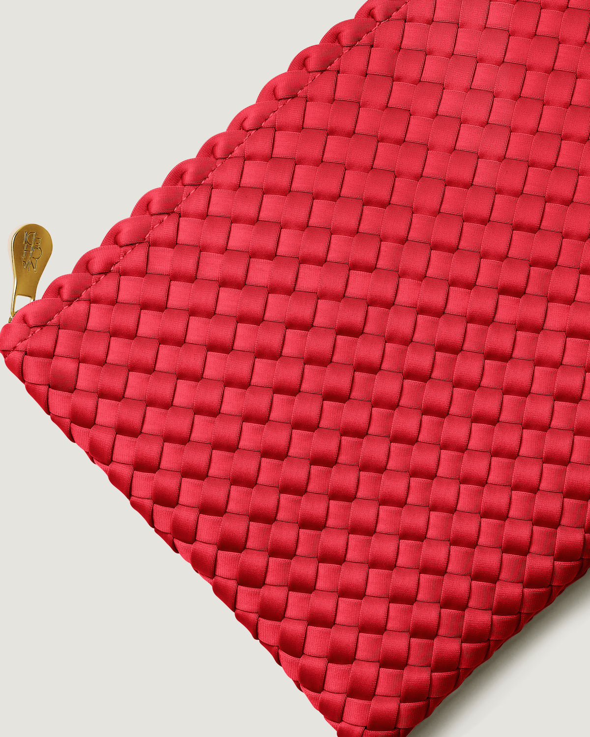 Close-up of included matching woven zippered pouch.