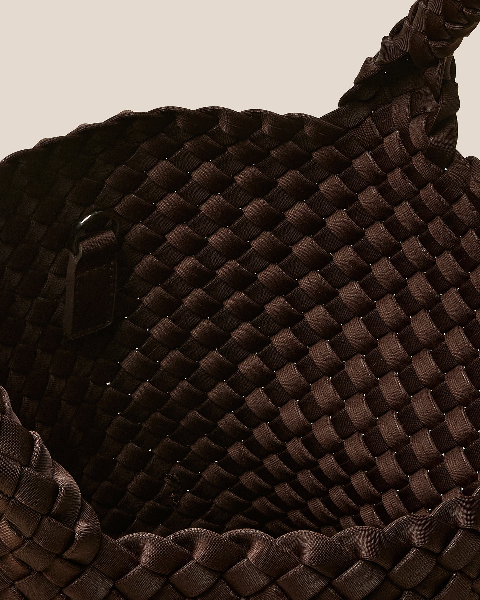 Interior close-up of St. Barths Small Tote Bag in Chocolate showing its open top, and unlined interior.