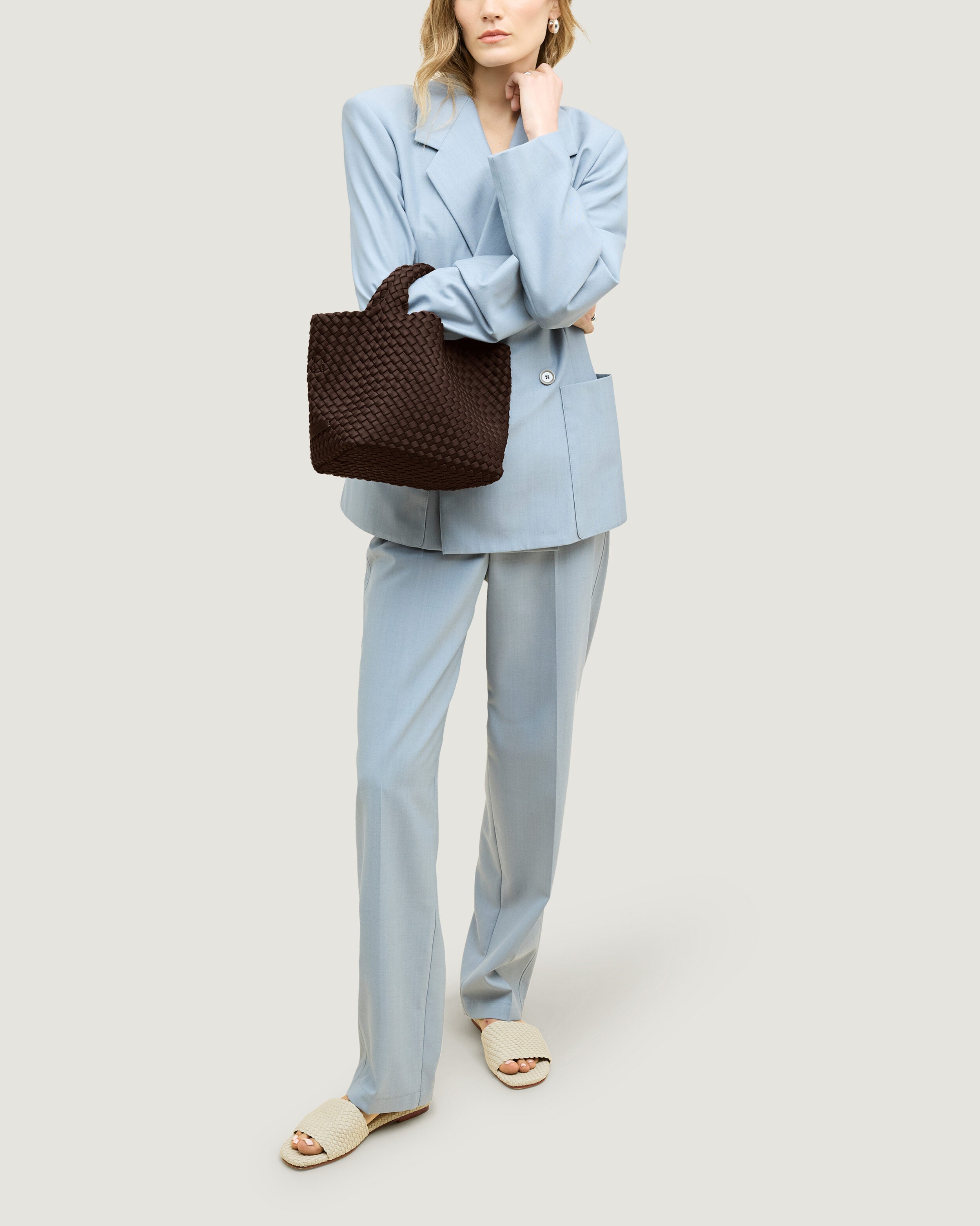 St. Barths Tote in Chocolate shown on model to illustrate scale and soft silhouette.