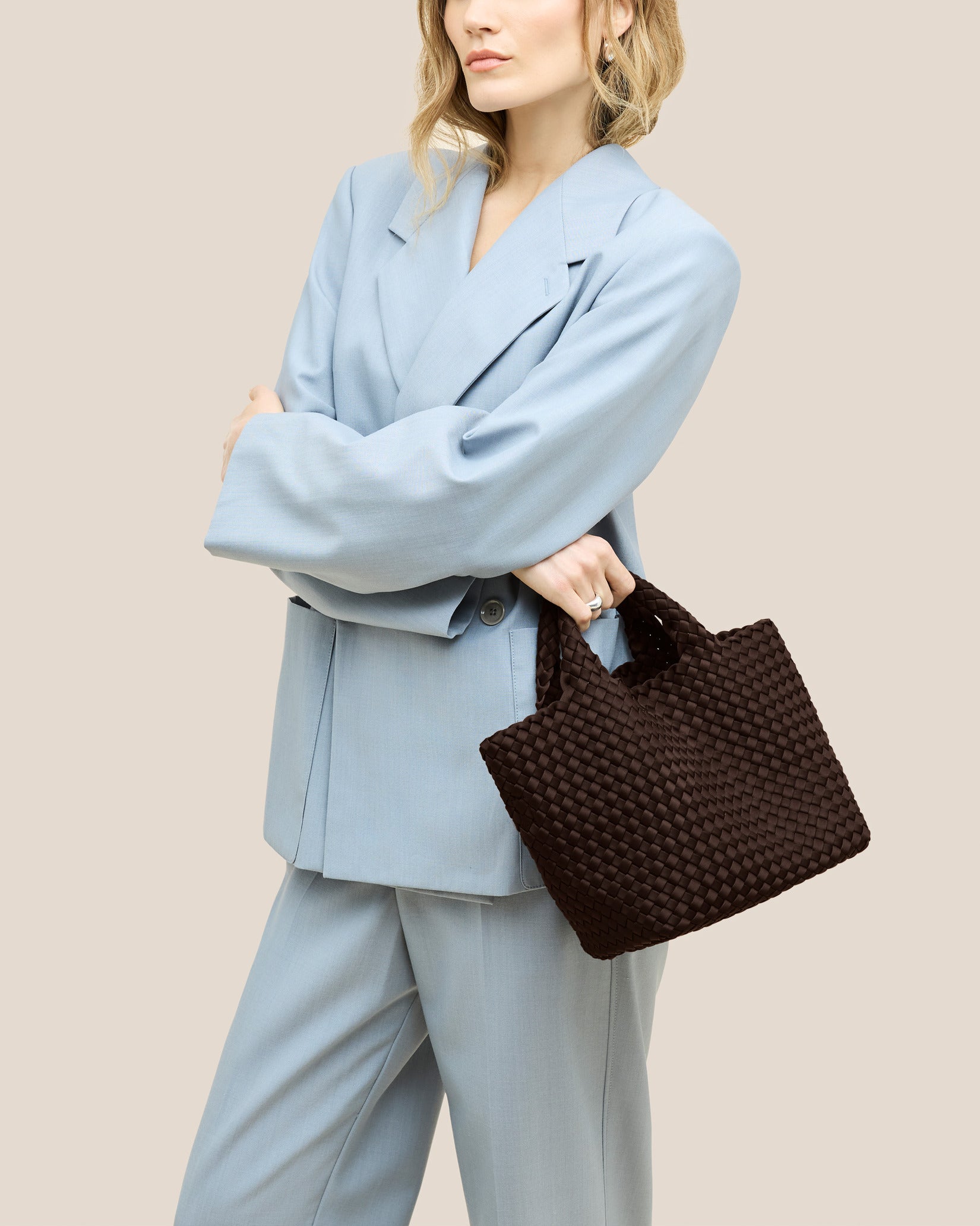 St. Barths Small Tote Bag in Chocolate shown on model to illustrate scale and soft silhouette.