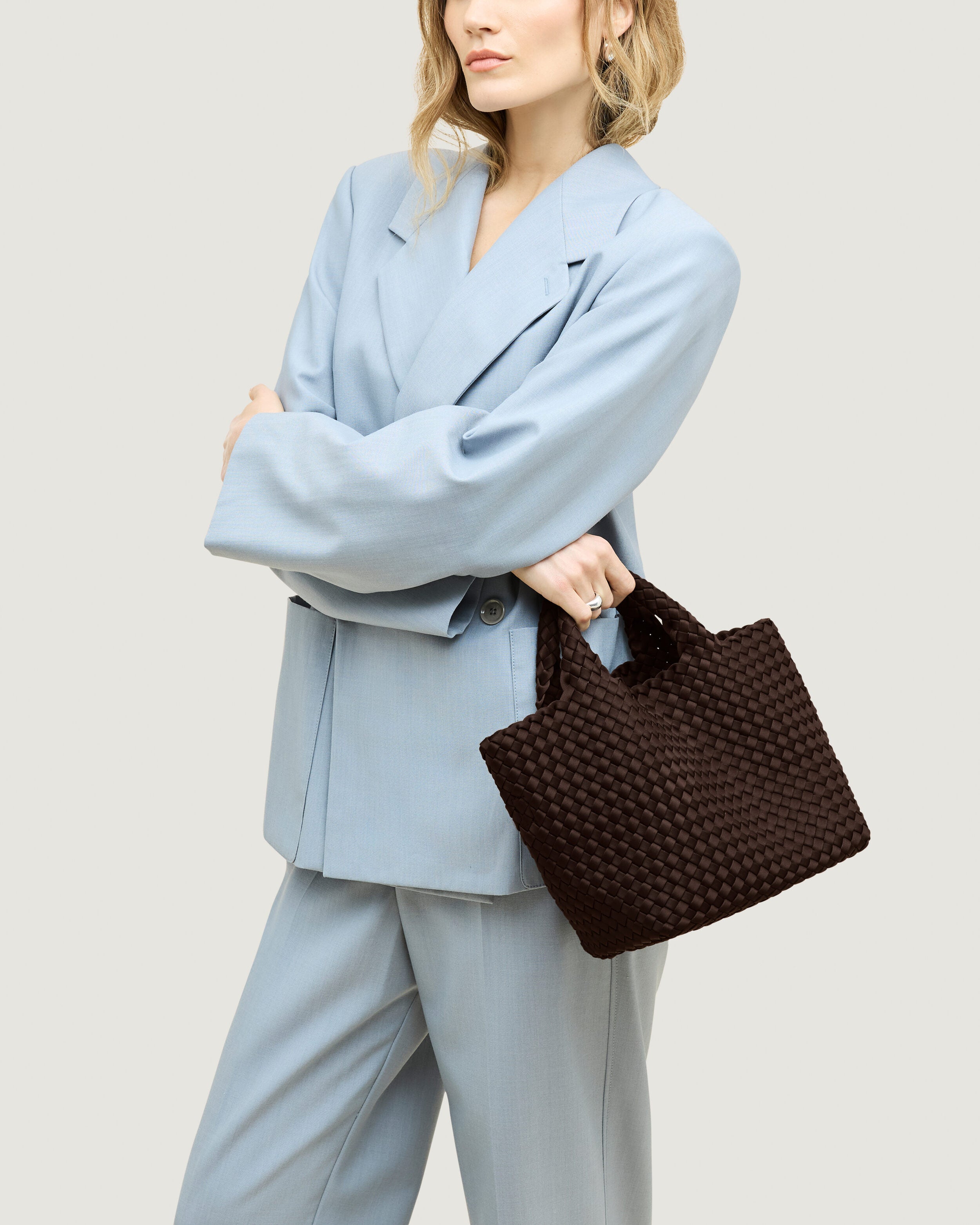 St. Barths Tote in Chocolate shown on model to illustrate scale and soft silhouette.