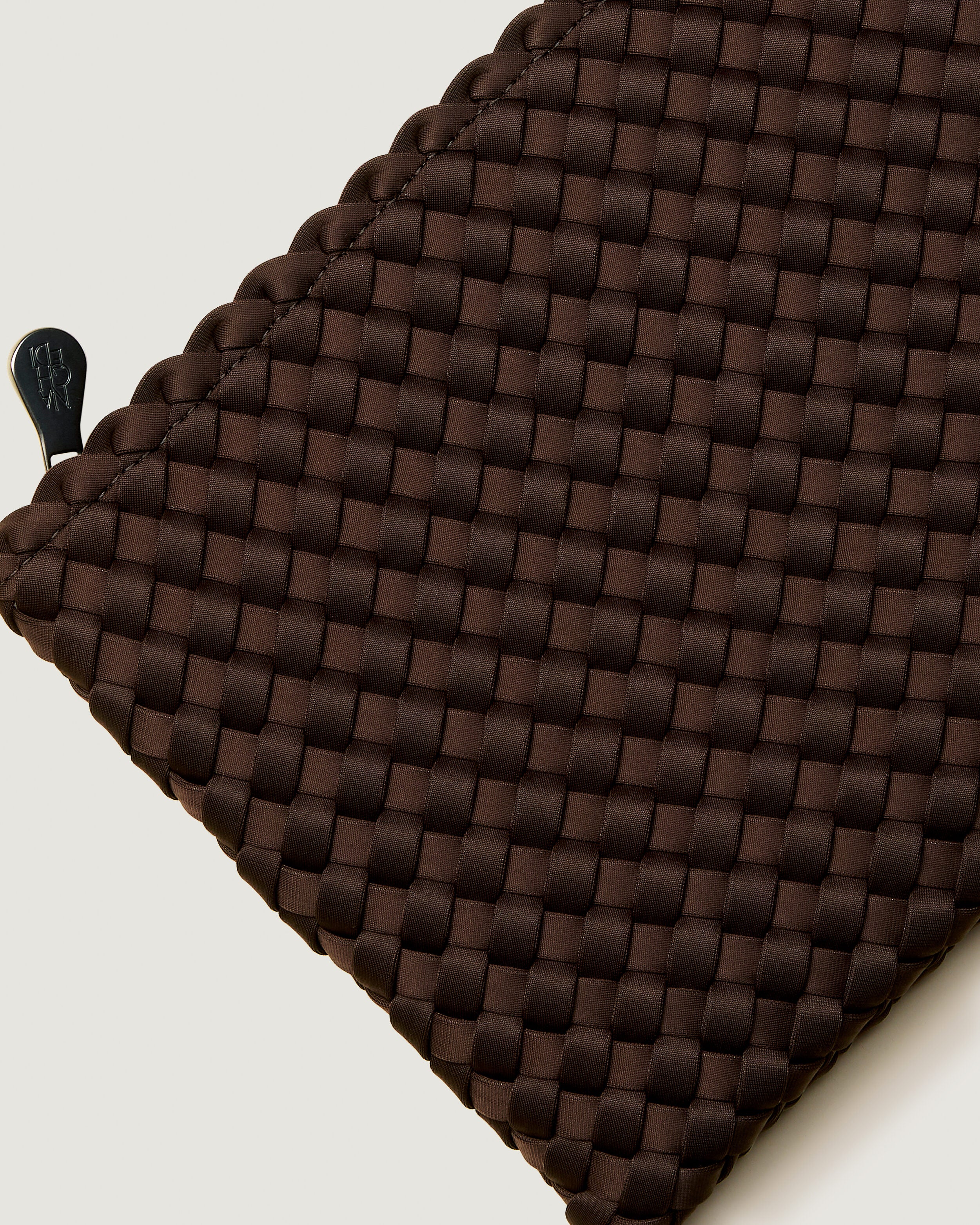 Close-up of included matching woven zippered pouch.