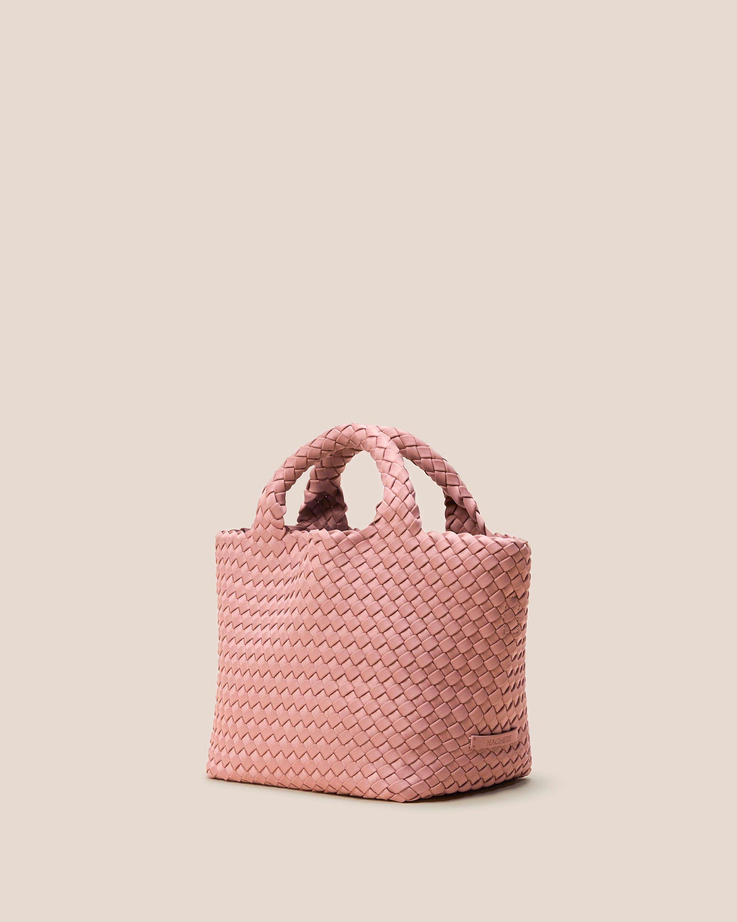 St. Barths Tote in Dusk shown from a side angle, highlighting its handwoven neoprene construction and open top.