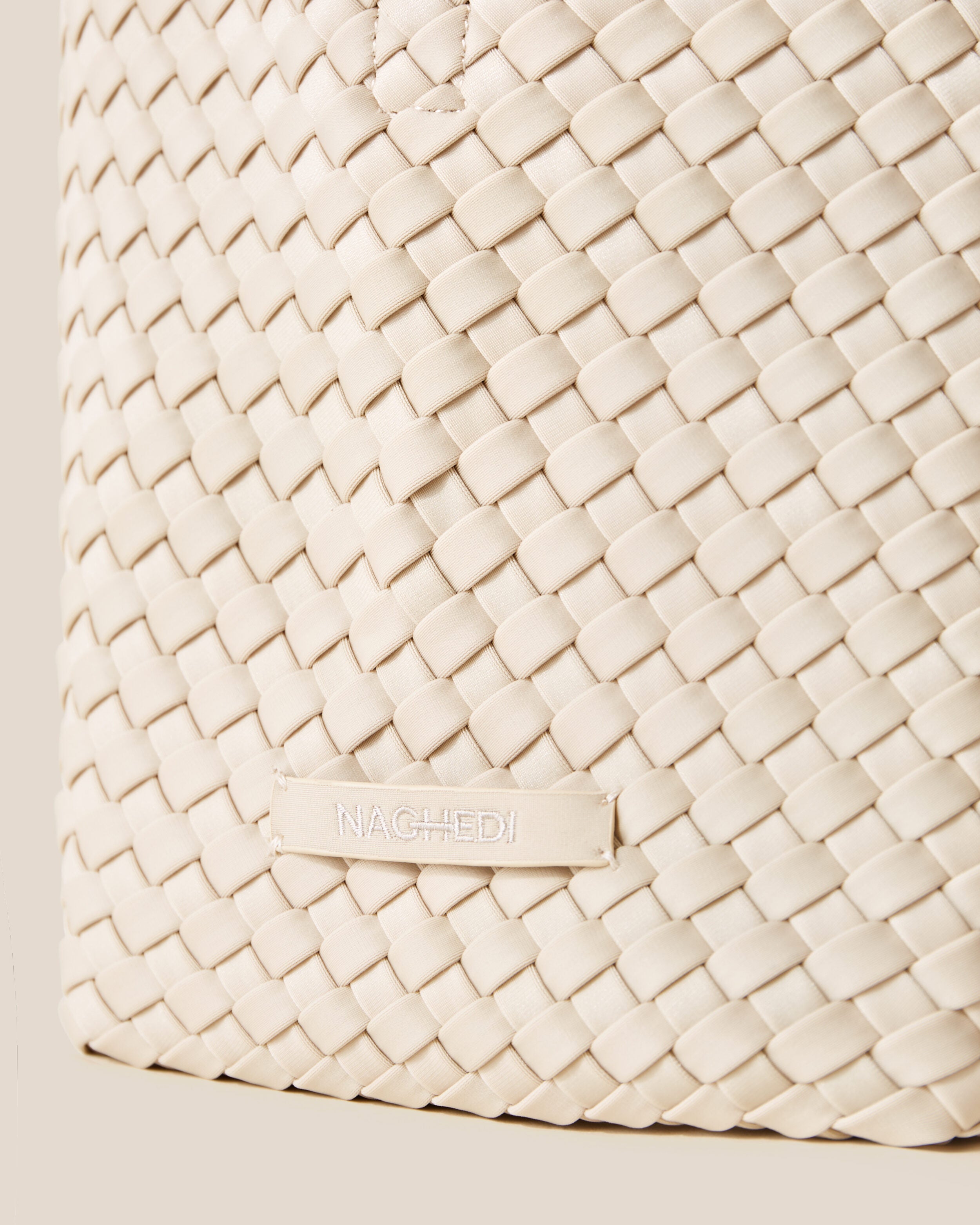 Close-up of stamped NAGHEDI logo on St. Barths Tote in Ecru.