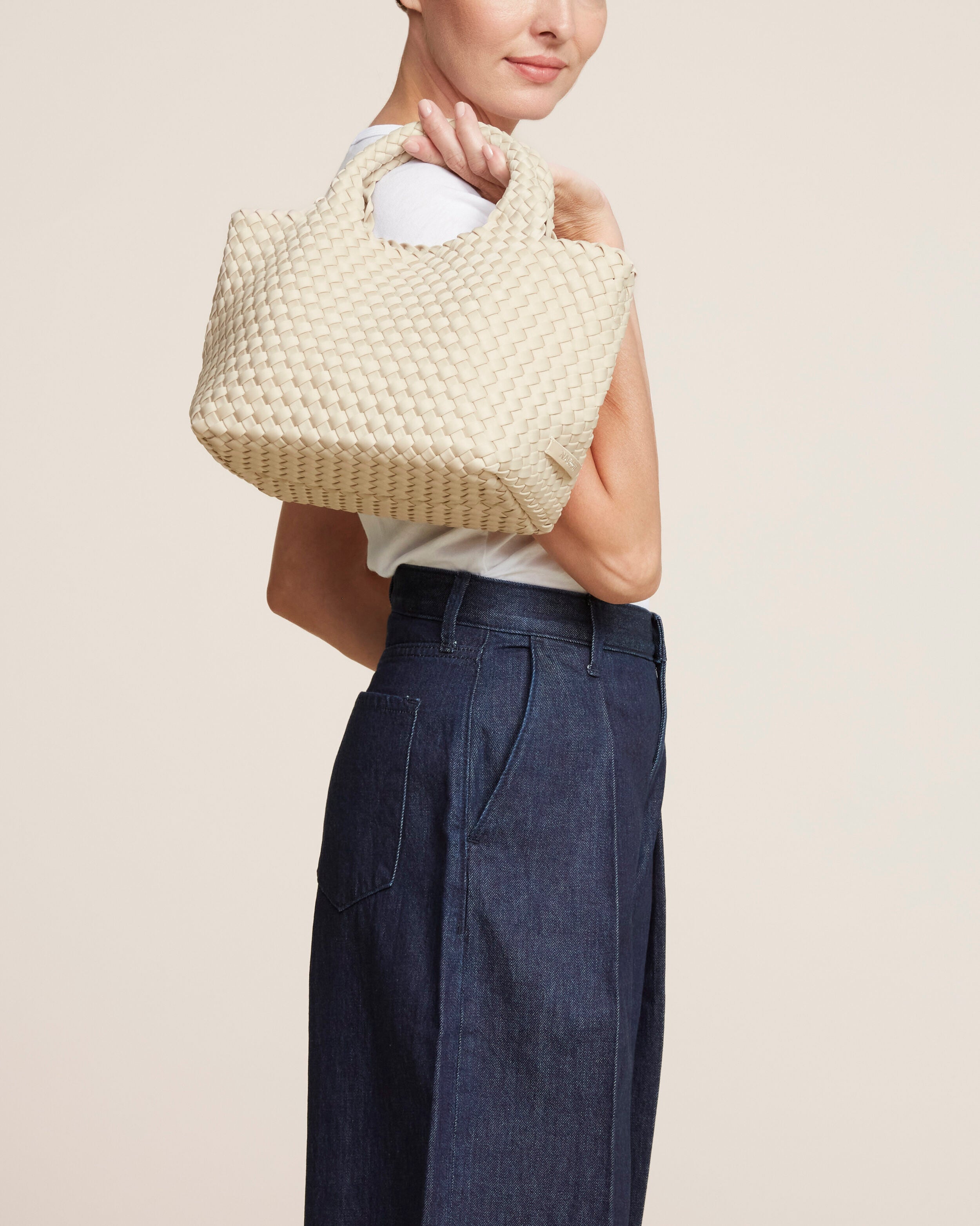 St. Barths Tote in Ecru shown on model to illustrate scale and soft silhouette.