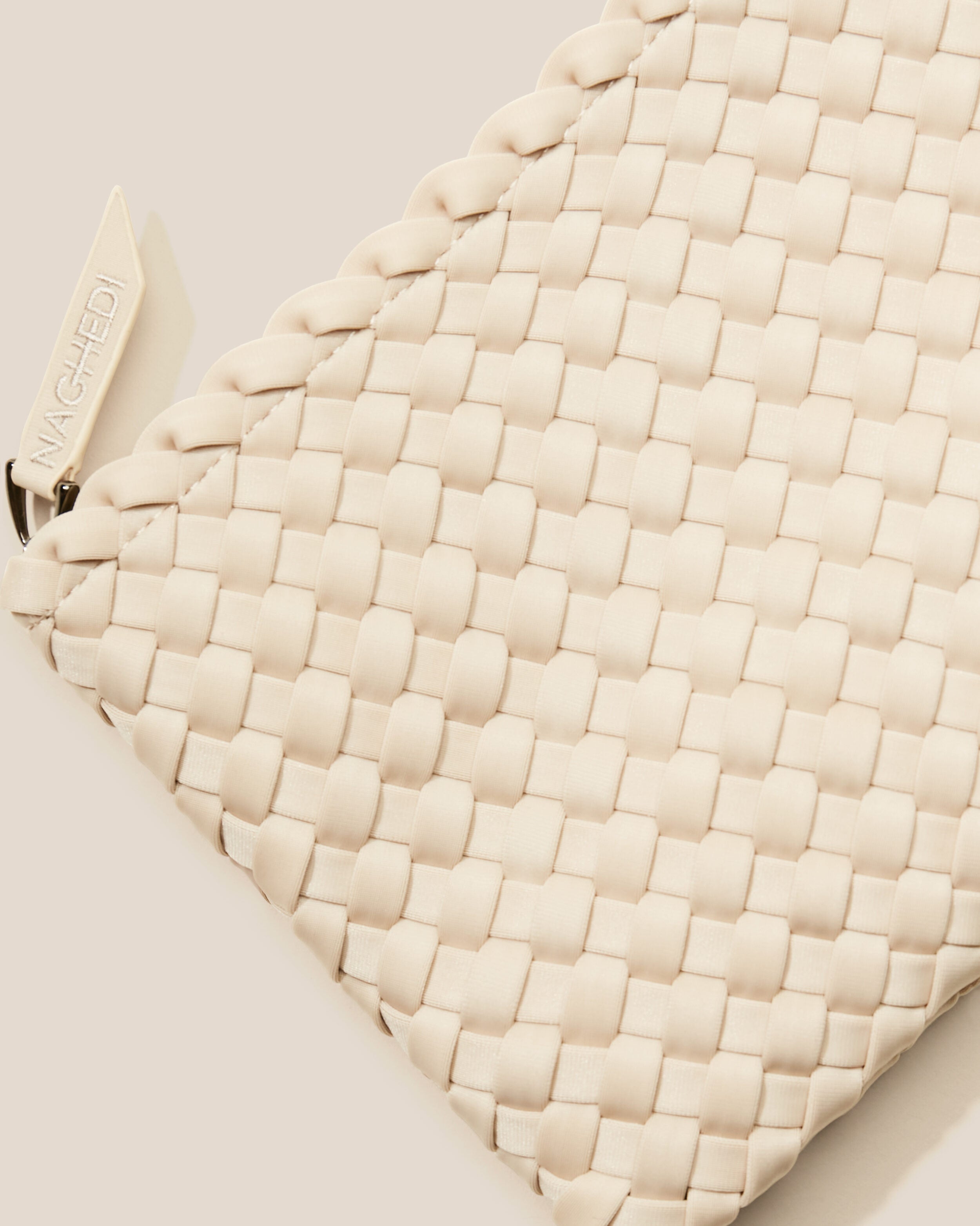 Close-up of included matching woven zippered pouch.