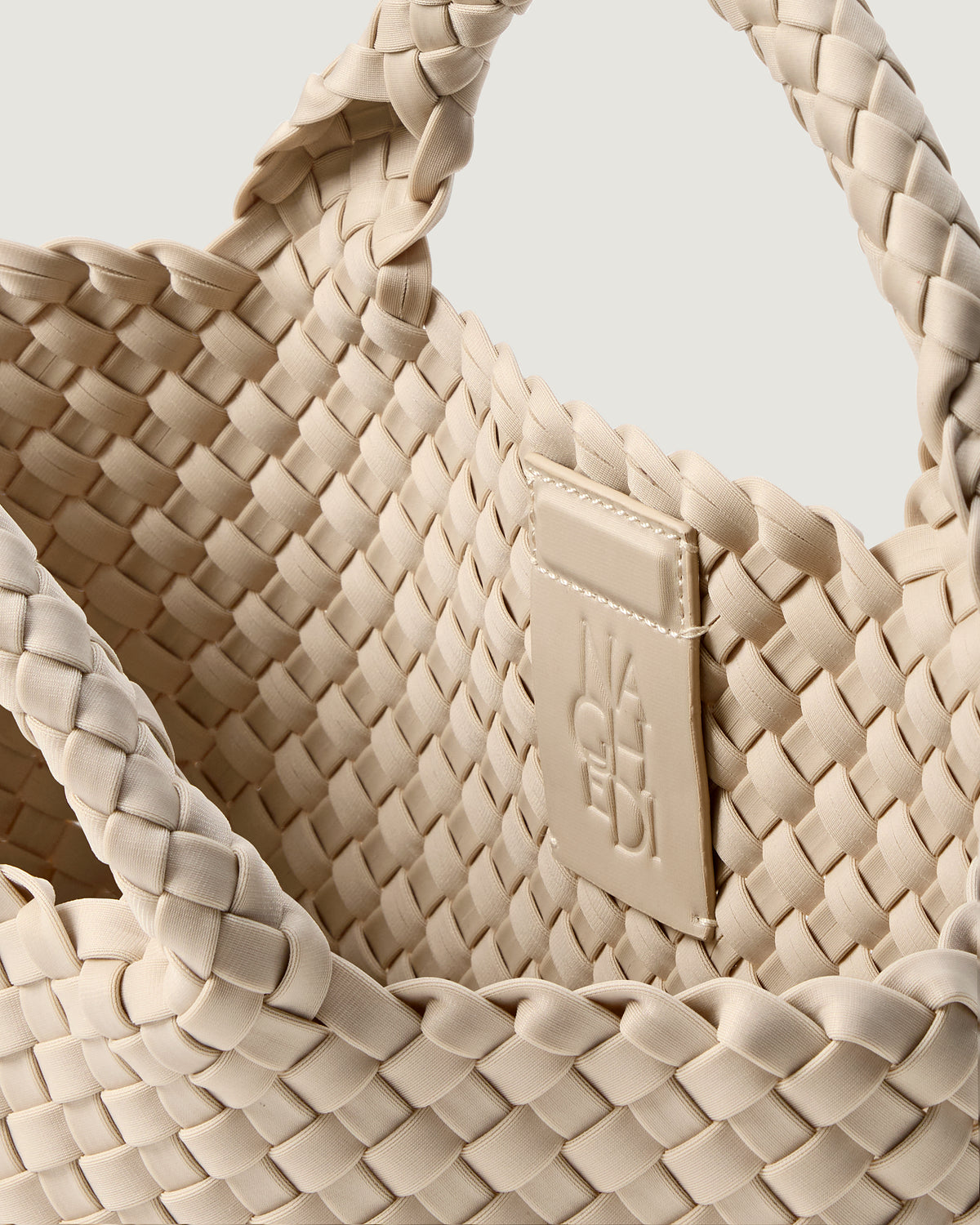 Interior close-up of St. Barths Tote in Ecru showing its magnetic snap closure, and unlined interior.