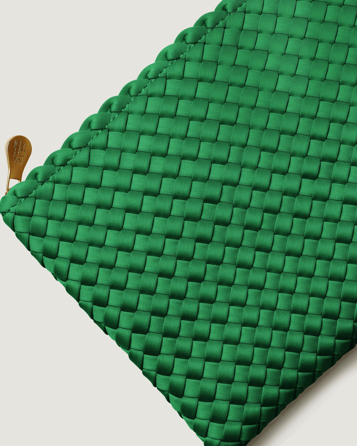 Close-up of included matching woven zippered pouch.